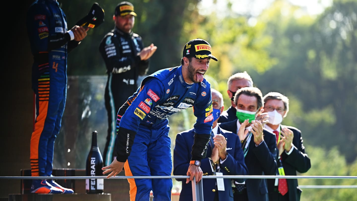 MONZA, ITALY - SEPTEMBER 12: Race winner Daniel Ricciardo of Australia and McLaren F1 celebrates on the podium during the F1 Grand Prix of Italy at Autodromo di Monza on September 12, 2021 in Monza, Italy. (Photo by Clive Mason - Formula 1/Formula 1 via Getty Images)