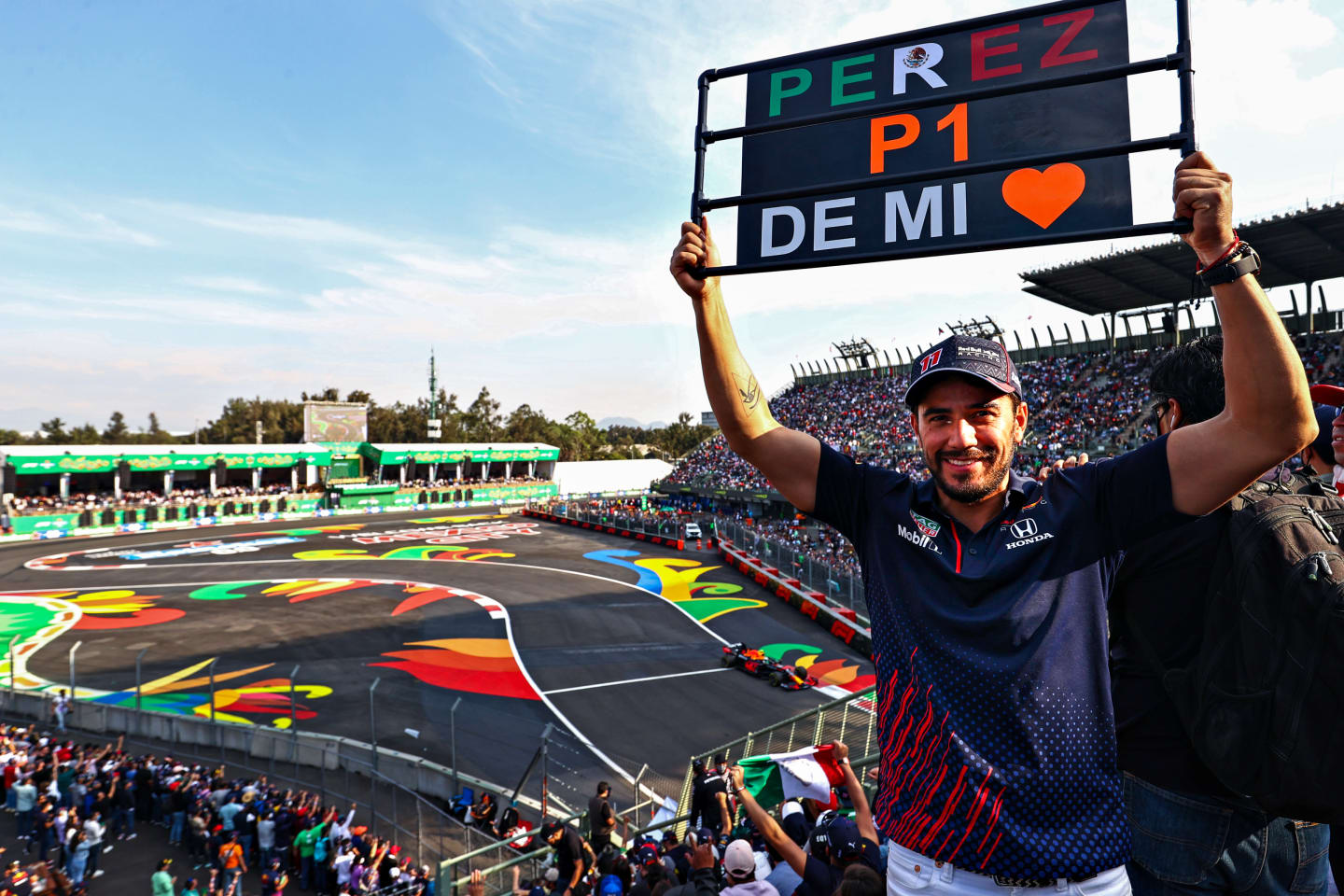 MEXICO CITY, MEXICO - NOVEMBER 05: A Sergio Perez of Mexico and Red Bull Racing fan shows their support in the grandstand during practice ahead of the F1 Grand Prix of Mexico at Autodromo Hermanos Rodriguez on November 05, 2021 in Mexico City, Mexico. (Photo by Mark Thompson/Getty Images)