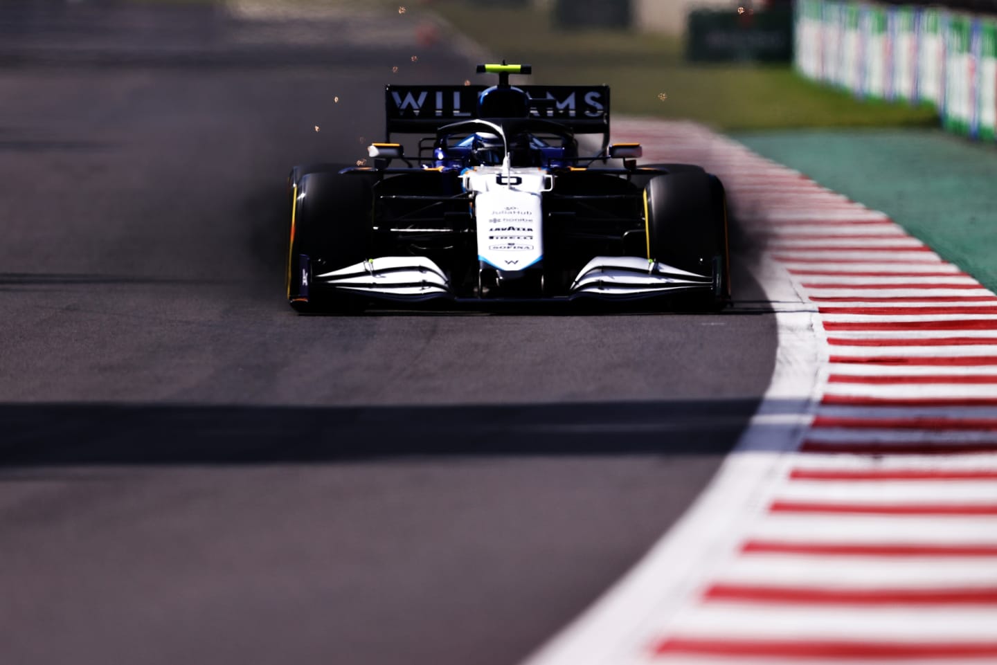 MEXICO CITY, MEXICO - NOVEMBER 06: Brake dust pours from the front brakes of Nicholas Latifi of Canada driving the (6) Williams Racing FW43B Mercedes during qualifying ahead of the F1 Grand Prix of Mexico at Autodromo Hermanos Rodriguez on November 06, 2021 in Mexico City, Mexico. (Photo by Lars Baron/Getty Images)