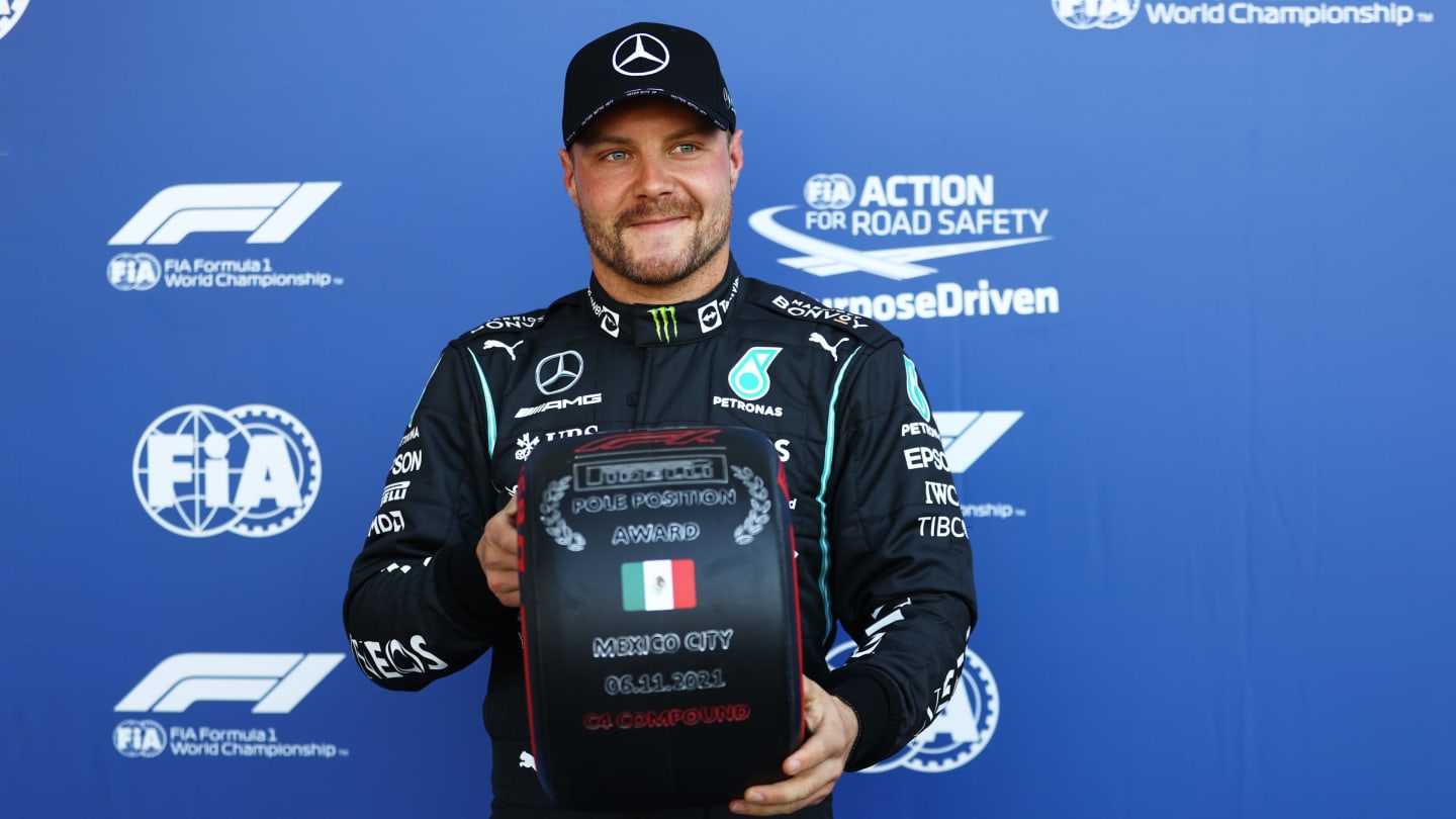 MEXICO CITY, MEXICO - NOVEMBER 06: Pole position qualifier Valtteri Bottas of Finland and Mercedes GP celebrates in parc ferme during qualifying ahead of the F1 Grand Prix of Mexico at Autodromo Hermanos Rodriguez on November 06, 2021 in Mexico City, Mexico. (Photo by Bryn Lennon - Formula 1/Formula 1 via Getty Images)