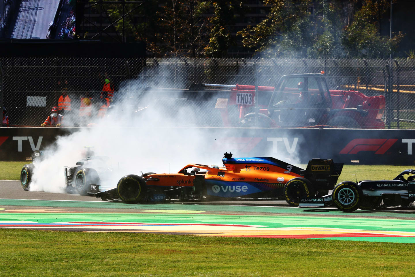 MEXICO CITY, MEXICO - NOVEMBER 07: Daniel Ricciardo of Australia driving the (3) McLaren F1 Team MCL35M Mercedes passes Valtteri Bottas of Finland driving the (77) Mercedes AMG Petronas F1 Team Mercedes W12 after he span at the start during the F1 Grand Prix of Mexico at Autodromo Hermanos Rodriguez on November 07, 2021 in Mexico City, Mexico. (Photo by Mark Thompson/Getty Images)