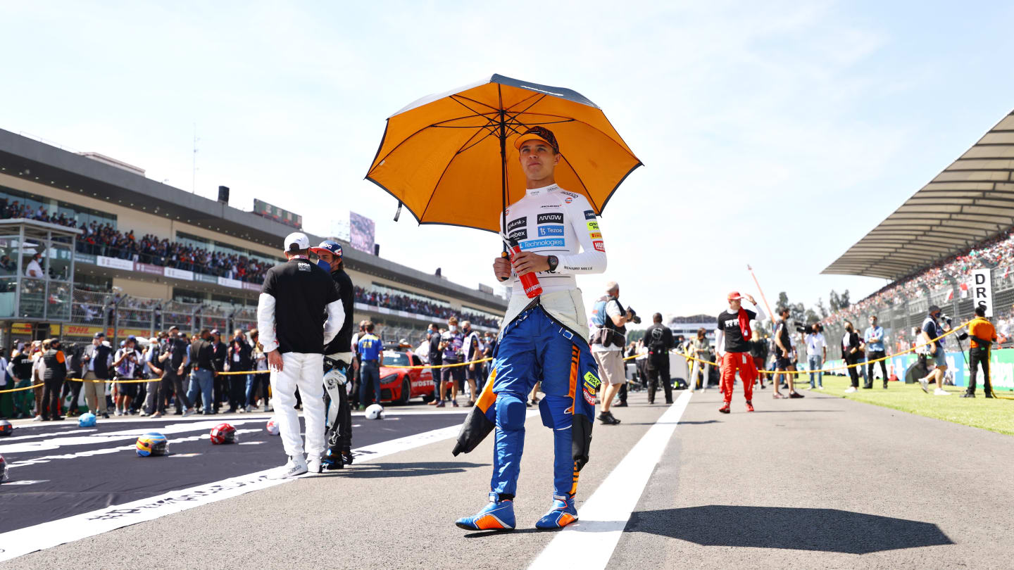 MEXICO CITY, MEXICO - NOVEMBER 07: Lando Norris of Great Britain and McLaren F1 walks to the grid before the F1 Grand Prix of Mexico at Autodromo Hermanos Rodriguez on November 07, 2021 in Mexico City, Mexico. (Photo by Bryn Lennon - Formula 1/Formula 1 via Getty Images)