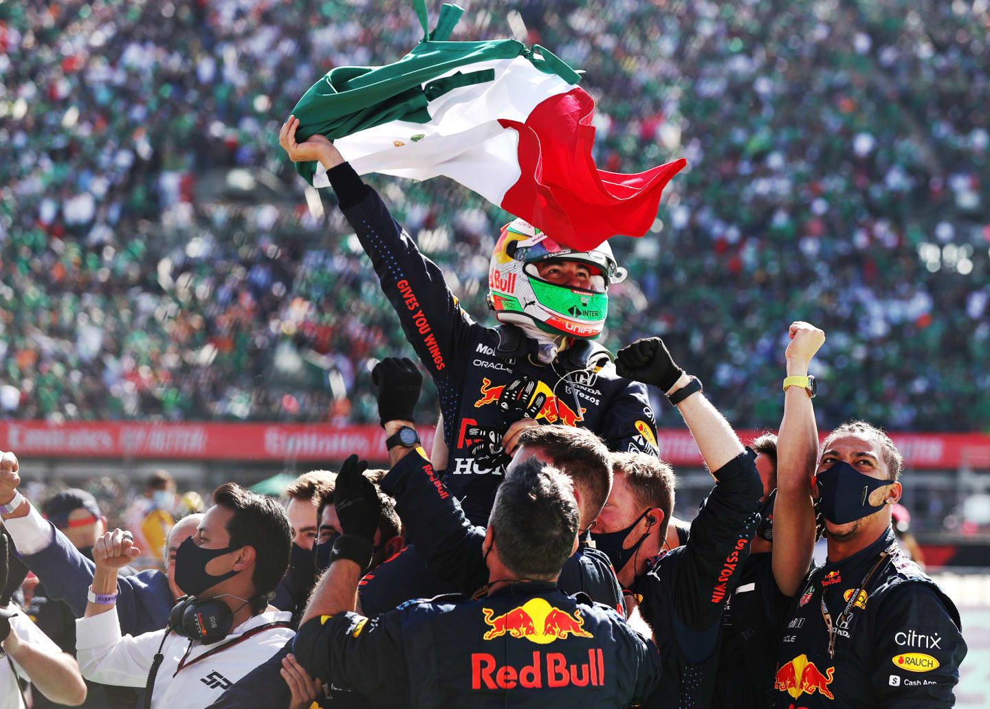 MEXICO CITY, MEXICO - NOVEMBER 07: Third placed Sergio Perez of Mexico and Red Bull Racing celebrates in parc ferme during the F1 Grand Prix of Mexico at Autodromo Hermanos Rodriguez on November 07, 2021 in Mexico City, Mexico. (Photo by Lars Baron/Getty Images)