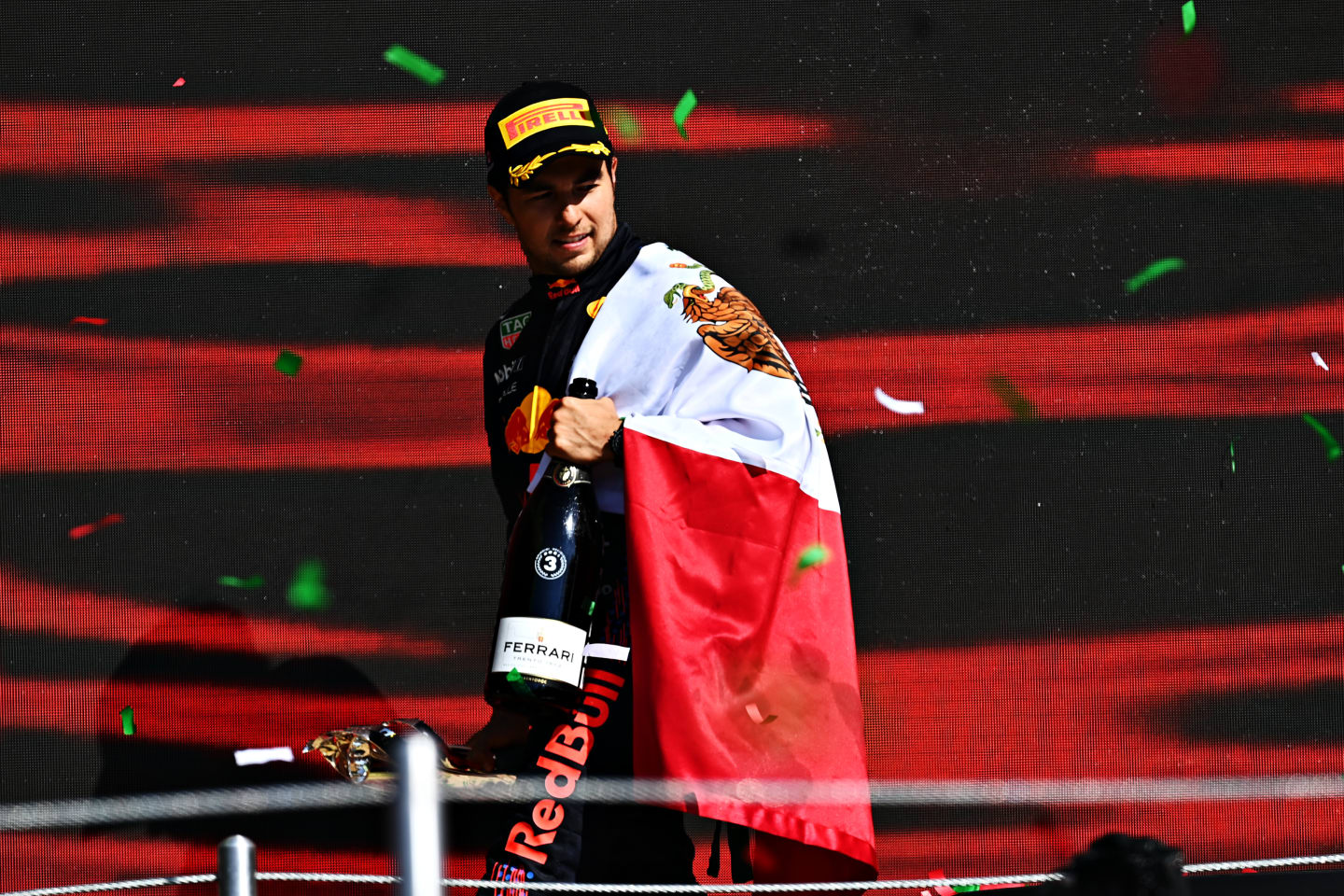 MEXICO CITY, MEXICO - NOVEMBER 07: Third placed Sergio Perez of Mexico and Red Bull Racing celebrates on the podium during the F1 Grand Prix of Mexico at Autodromo Hermanos Rodriguez on November 07, 2021 in Mexico City, Mexico. (Photo by Clive Mason/Getty Images)