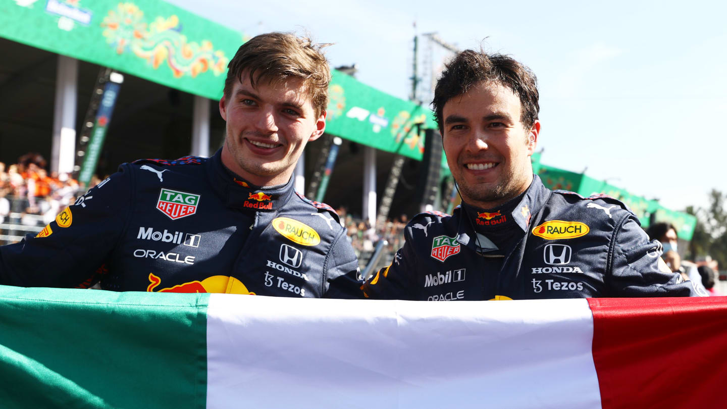 MEXICO CITY, MEXICO - NOVEMBER 07: Race winner Max Verstappen of Netherlands and Red Bull Racing and third placed Sergio Perez of Mexico and Red Bull Racing celebrate in parc ferme during the F1 Grand Prix of Mexico at Autodromo Hermanos Rodriguez on November 07, 2021 in Mexico City, Mexico. (Photo by Bryn Lennon - Formula 1/Formula 1 via Getty Images)