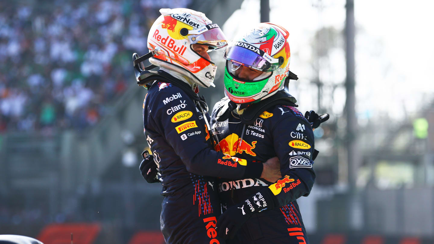 MEXICO CITY, MEXICO - NOVEMBER 07: Race winner Max Verstappen of Netherlands and Red Bull Racing and third placed Sergio Perez of Mexico and Red Bull Racing celebrate in parc ferme during the F1 Grand Prix of Mexico at Autodromo Hermanos Rodriguez on November 07, 2021 in Mexico City, Mexico. (Photo by Bryn Lennon - Formula 1/Formula 1 via Getty Images)