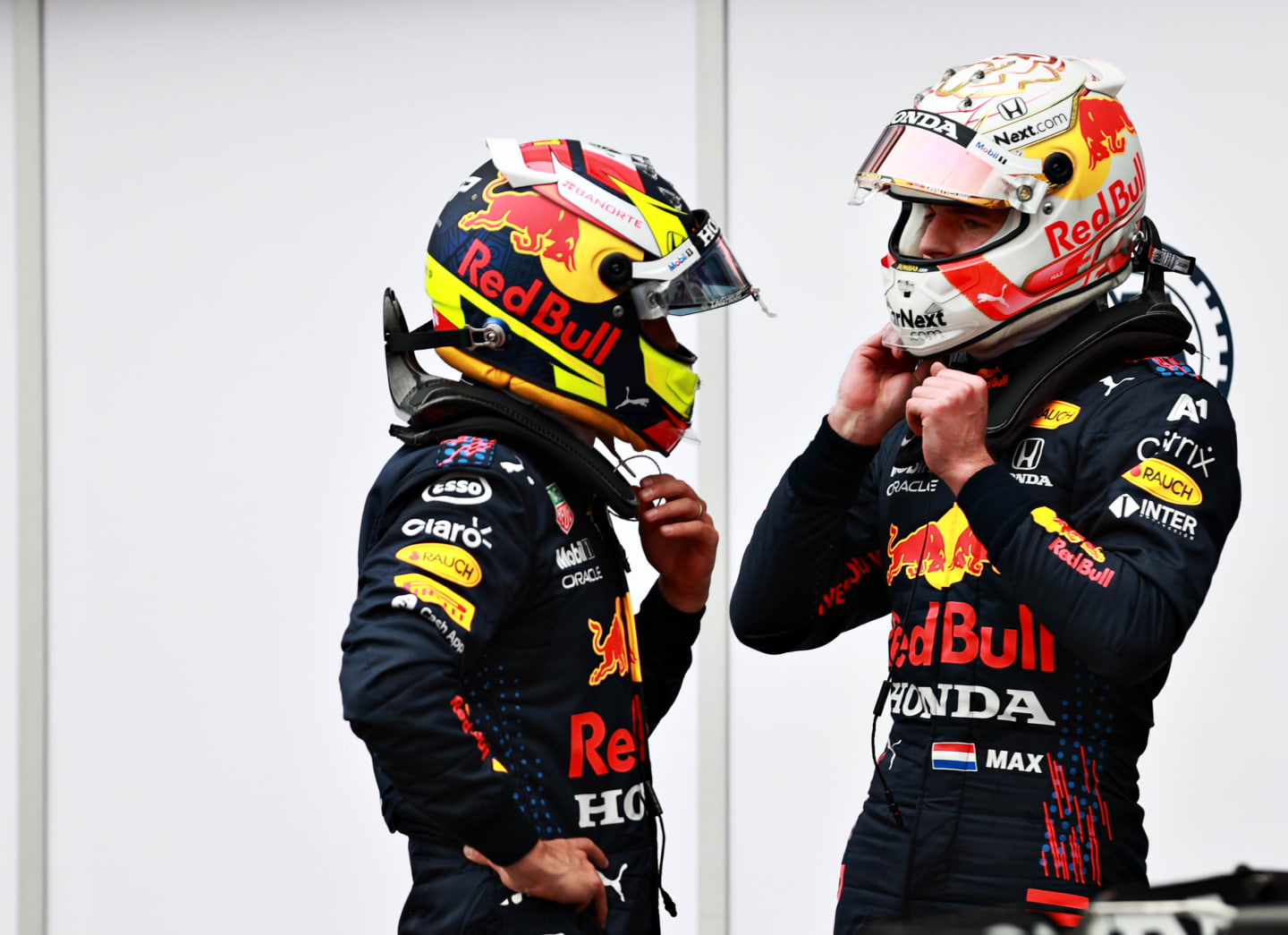 MONTE-CARLO, MONACO - MAY 22: Second place qualifier Max Verstappen of Netherlands and Red Bull Racing talks with Sergio Perez of Mexico and Red Bull Racing in parc ferme during qualifying for the F1 Grand Prix of Monaco at Circuit de Monaco on May 22, 2021 in Monte-Carlo, Monaco. (Photo by Mark Thompson/Getty Images)