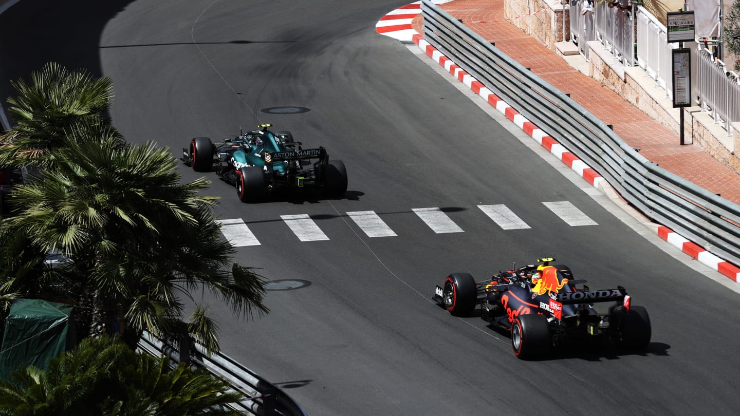 MONTE-CARLO, MONACO - MAY 23: Sergio Perez of Mexico driving the (11) Red Bull Racing RB16B Honda follows Sebastian Vettel of Germany driving the (5) Aston Martin AMR21 Mercedes during the F1 Grand Prix of Monaco at Circuit de Monaco on May 23, 2021 in Monte-Carlo, Monaco. (Photo by Clive Rose - Formula 1/Formula 1 via Getty Images)