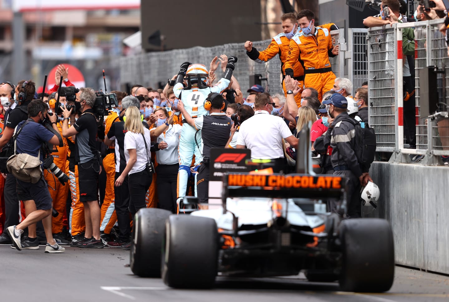 MONTE-CARLO, MONACO - MAY 23: Third placed Lando Norris of Great Britain and McLaren F1 celebrates with his team in parc ferme during the F1 Grand Prix of Monaco at Circuit de Monaco on May 23, 2021 in Monte-Carlo, Monaco. (Photo by Lars Baron/Getty Images)