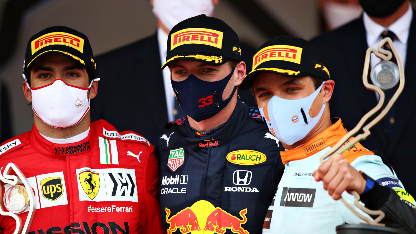 MONTE-CARLO, MONACO - MAY 23: Race winner Max Verstappen of Netherlands and Red Bull Racing, second placed Carlos Sainz of Spain and Ferrari and third placed Lando Norris of Great Britain and McLaren F1 celebrate on the podium during the F1 Grand Prix of Monaco at Circuit de Monaco on May 23, 2021 in Monte-Carlo, Monaco. (Photo by Joe Portlock - Formula 1/Formula 1 via Getty Images)