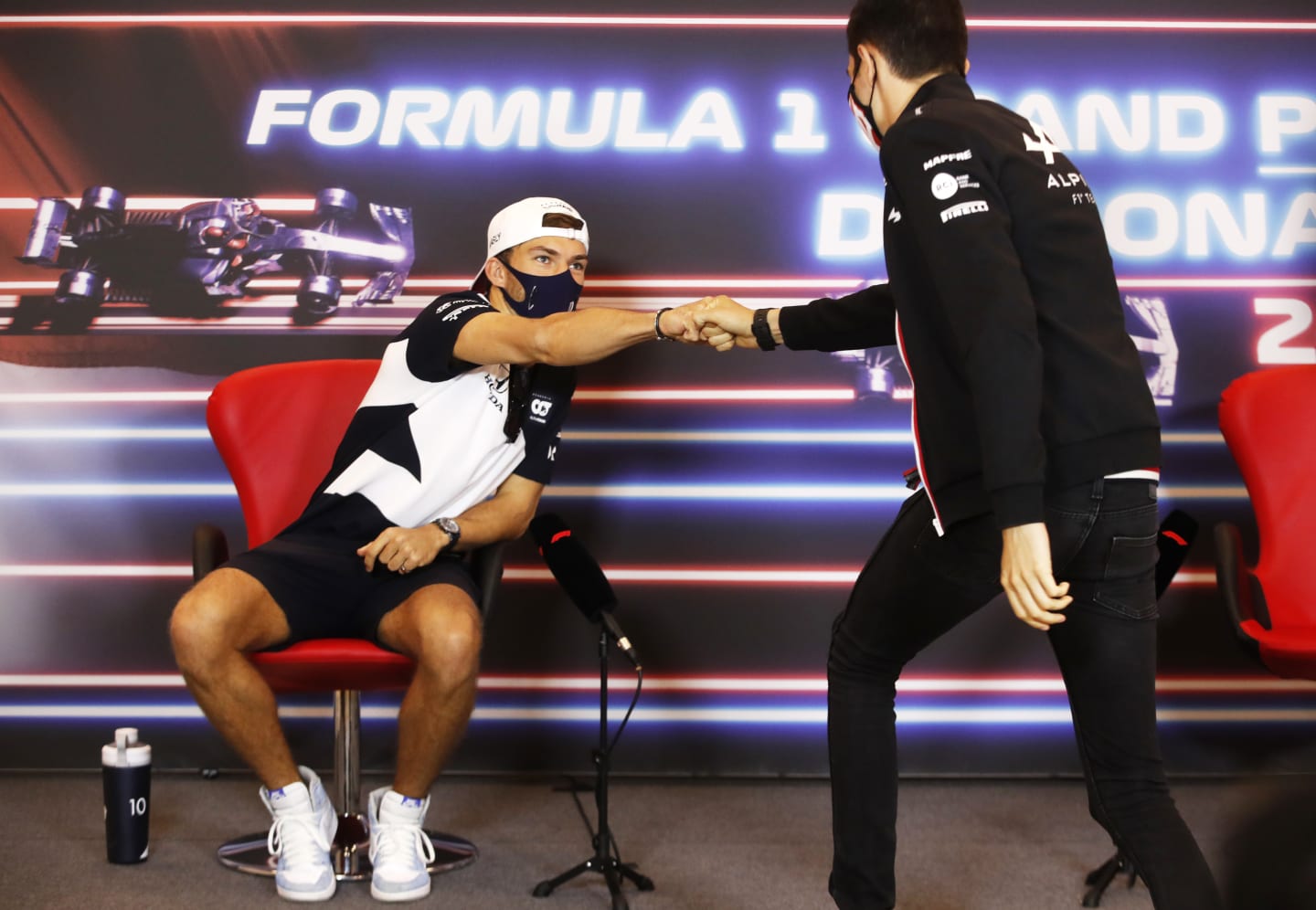 MONTE-CARLO, MONACO - MAY 19: Pierre Gasly of France and Scuderia AlphaTauri interacts with Esteban