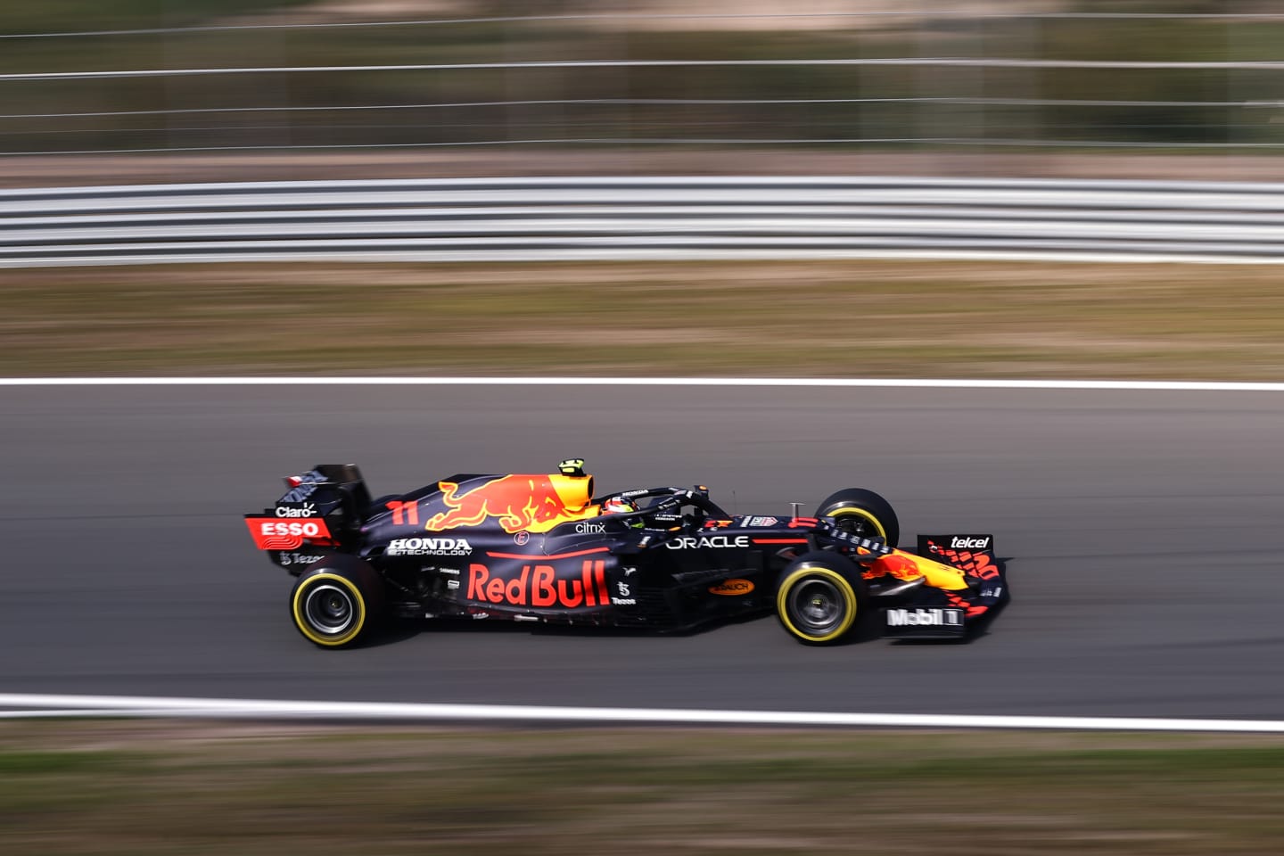 ZANDVOORT, NETHERLANDS - SEPTEMBER 03: Sergio Perez of Mexico driving the (11) Red Bull Racing RB16B Honda during practice ahead of the F1 Grand Prix of The Netherlands at Circuit Zandvoort on September 03, 2021 in Zandvoort, Netherlands. (Photo by Lars Baron/Getty Images)