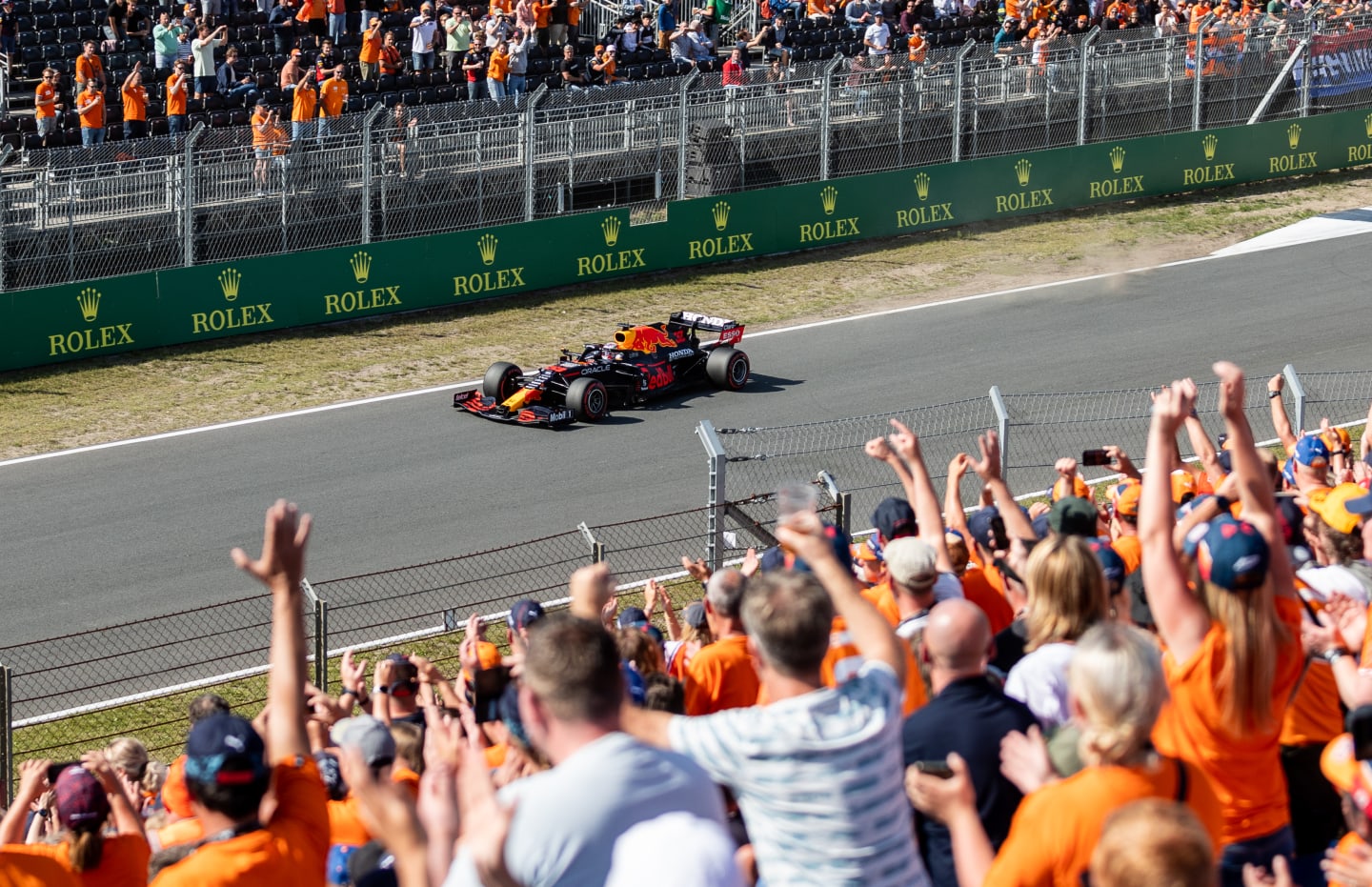 ZANDVOORT, NETHERLANDS - SEPTEMBER 04: Fans celebrate Max Verstappen of the Netherlands driving the
