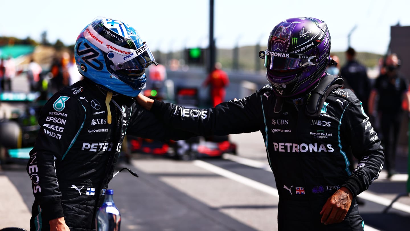 PORTIMAO, PORTUGAL - MAY 01: Pole position qualifier Valtteri Bottas of Finland and Mercedes GP and second place qualifier Lewis Hamilton of Great Britain and Mercedes GP congratulate each other in parc ferme during qualifying for the F1 Grand Prix of Portugal at Autodromo Internacional Do Algarve on May 01, 2021 in Portimao, Portugal. (Photo by Dan Istitene - Formula 1/Formula 1 via Getty Images)