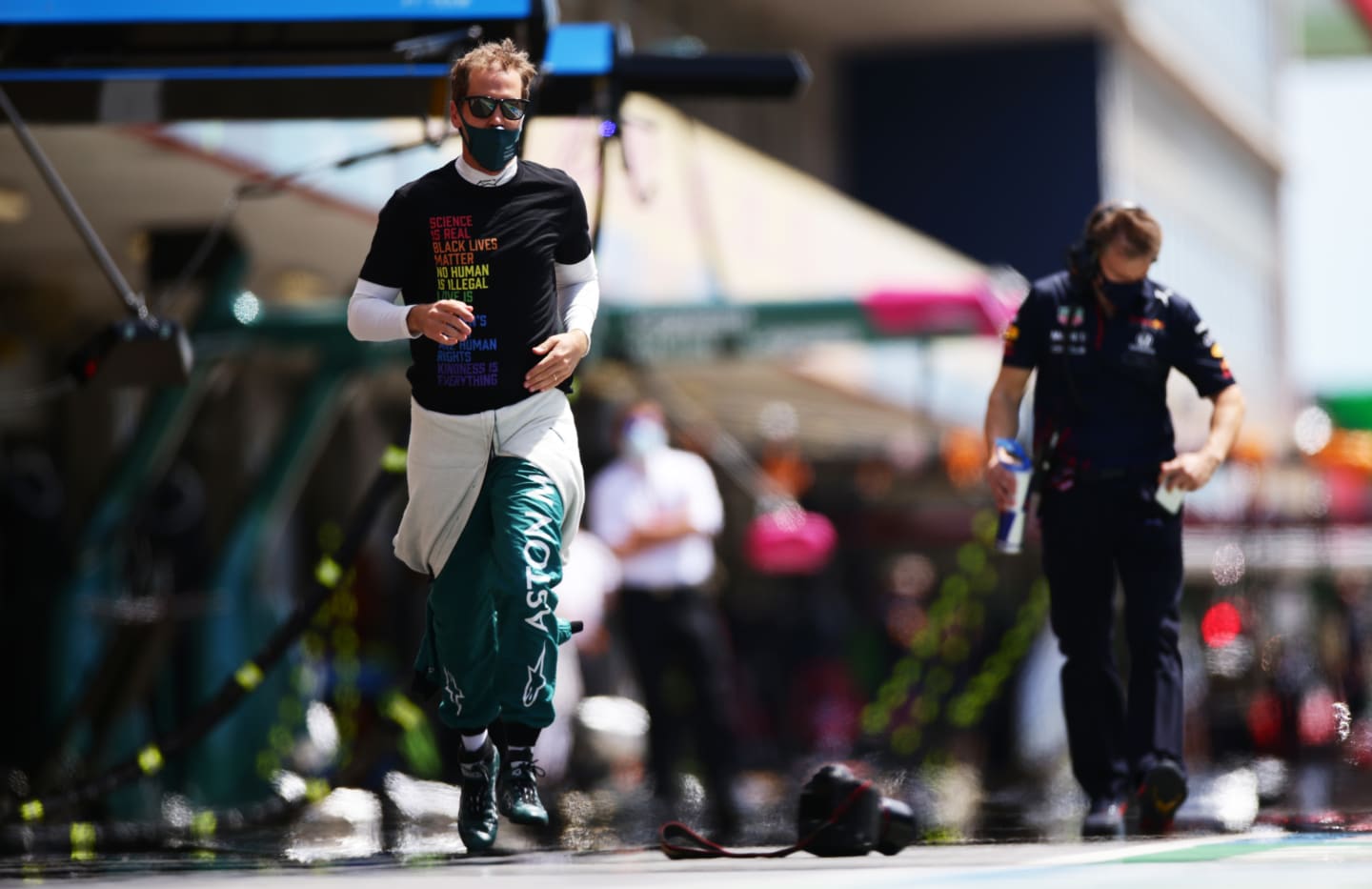 PORTIMAO, PORTUGAL - MAY 02: Sebastian Vettel of Germany and Aston Martin F1 Team runs to the grid during the F1 Grand Prix of Portugal at Autodromo Internacional Do Algarve on May 02, 2021 in Portimao, Portugal. (Photo by Peter Fox/Getty Images)