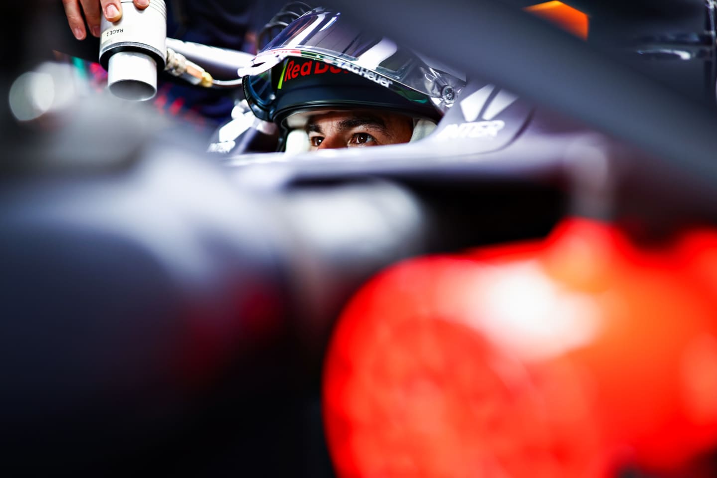 DOHA, QATAR - NOVEMBER 19: Sergio Perez of Mexico and Red Bull Racing prepares to drive in the garage during practice ahead of the F1 Grand Prix of Qatar at Losail International Circuit on November 19, 2021 in Doha, Qatar. (Photo by Mark Thompson/Getty Images)