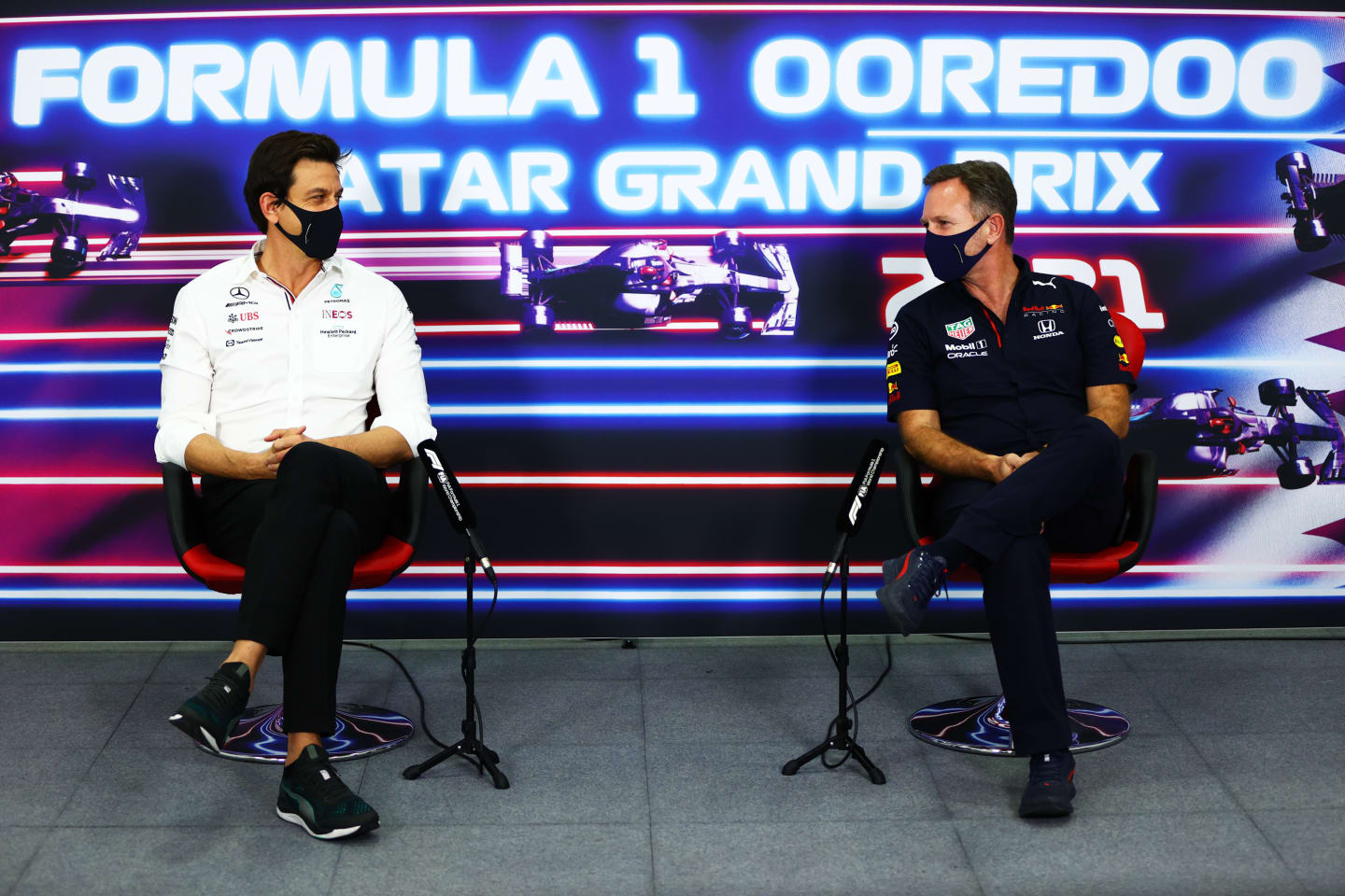 DOHA, QATAR - NOVEMBER 19: Mercedes GP Executive Director Toto Wolff and Red Bull Racing Team Principal Christian Horner talk in the Team Principals Press Conference during practice ahead of the F1 Grand Prix of Qatar at Losail International Circuit on November 19, 2021 in Doha, Qatar. (Photo by Dan Istitene/Getty Images)