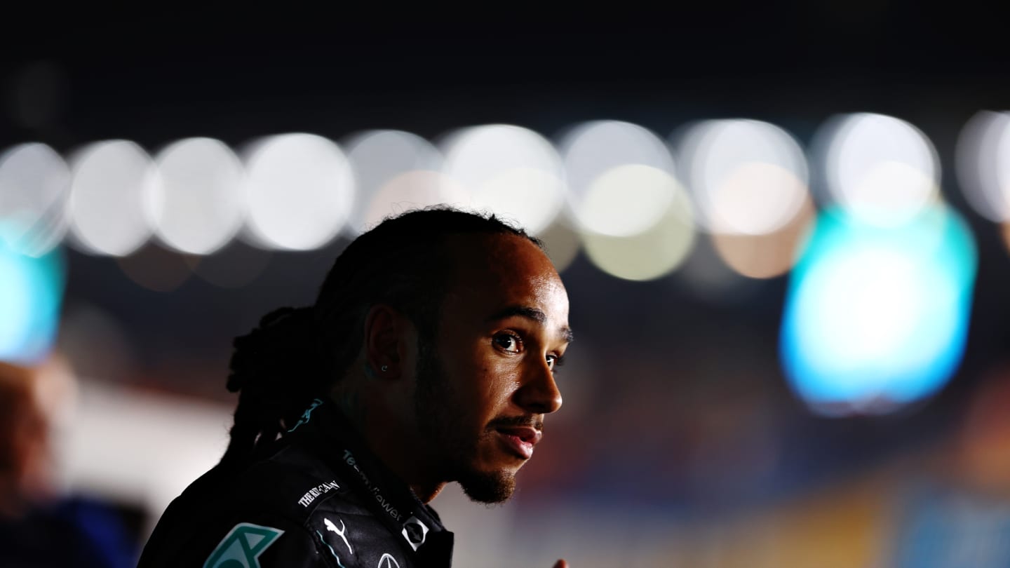 DOHA, QATAR - NOVEMBER 20: Pole position qualifier Lewis Hamilton of Great Britain and Mercedes GP talks to the media in parc ferme during qualifying ahead of the F1 Grand Prix of Qatar at Losail International Circuit on November 20, 2021 in Doha, Qatar. (Photo by Dan Istitene - Formula 1/Formula 1 via Getty Images)