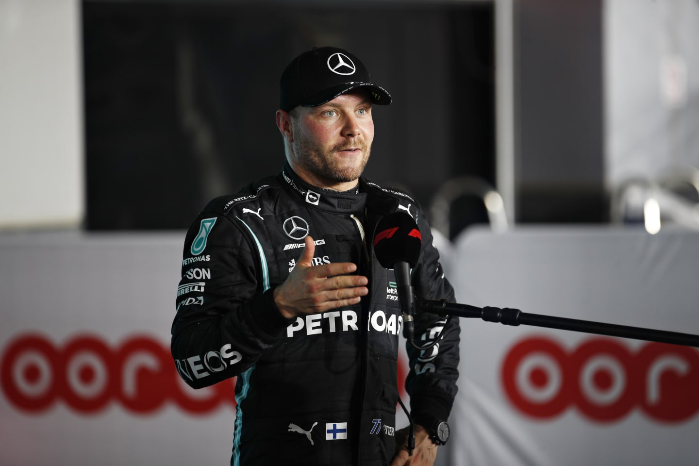 DOHA, QATAR - NOVEMBER 20: Third place qualifier Valtteri Bottas of Finland and Mercedes GP talks to the media in parc ferme during qualifying ahead of the F1 Grand Prix of Qatar at Losail International Circuit on November 20, 2021 in Doha, Qatar. (Photo by Hamad I Mohammed - Pool/Getty Images)