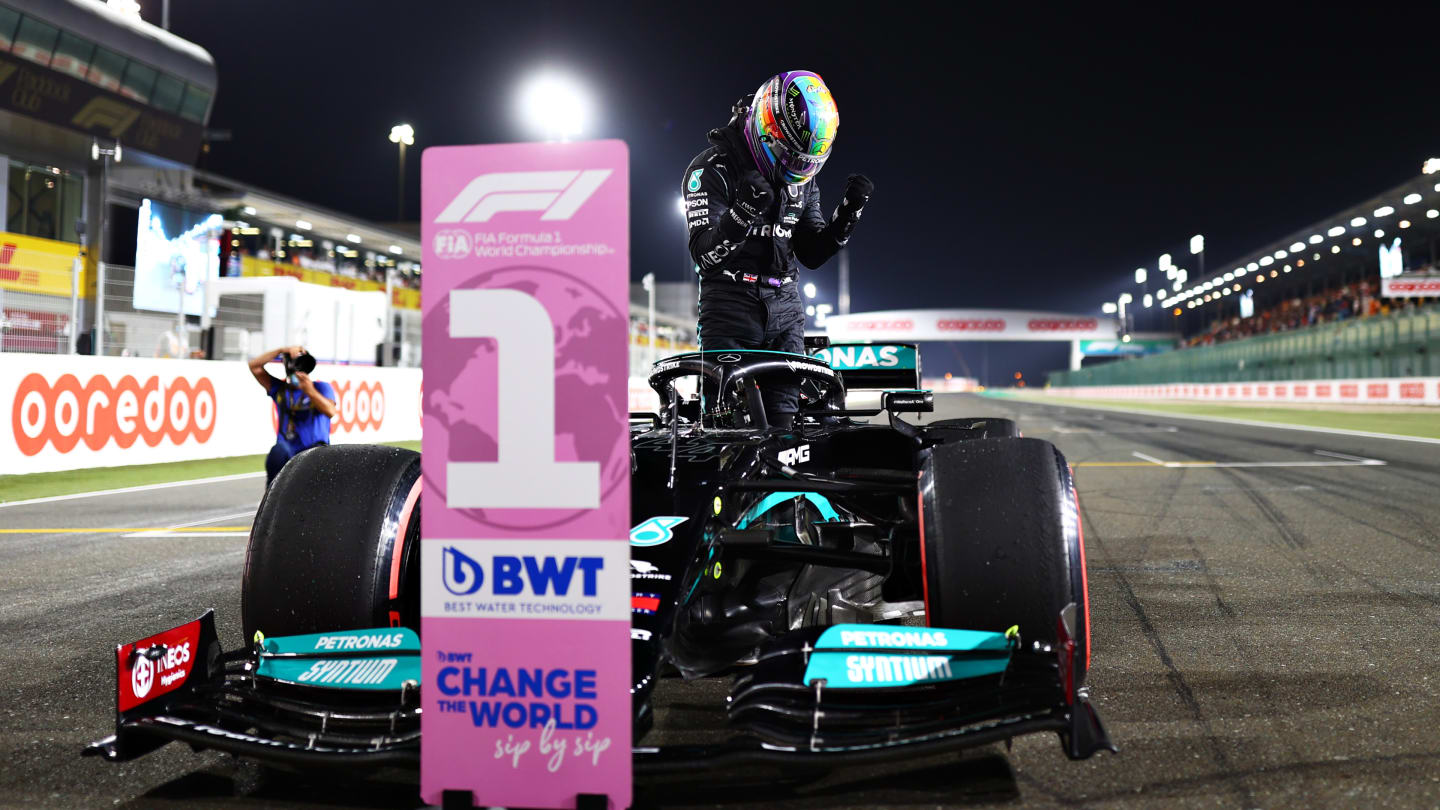 DOHA, QATAR - NOVEMBER 20: Pole position qualifier Lewis Hamilton of Great Britain and Mercedes GP
