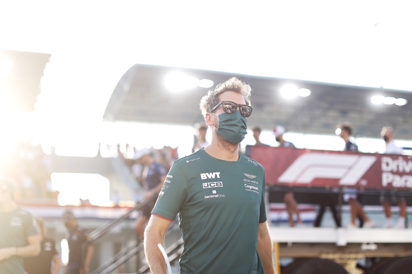 DOHA, QATAR - NOVEMBER 21: Sebastian Vettel of Germany driving the (5) Aston Martin AMR21 Mercedes on his way to the grid before the F1 Grand Prix of Qatar at Losail International Circuit on November 21, 2021 in Doha, Qatar. (Photo by Clive Mason/Getty Images)
