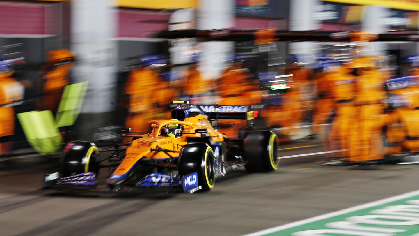 DOHA, QATAR - NOVEMBER 21: Lando Norris of Great Britain driving the (4) McLaren F1 Team MCL35M Mercedes makes a pitstop during the F1 Grand Prix of Qatar at Losail International Circuit on November 21, 2021 in Doha, Qatar. (Photo by Hamad I Mohammed - Pool/Getty Images)
