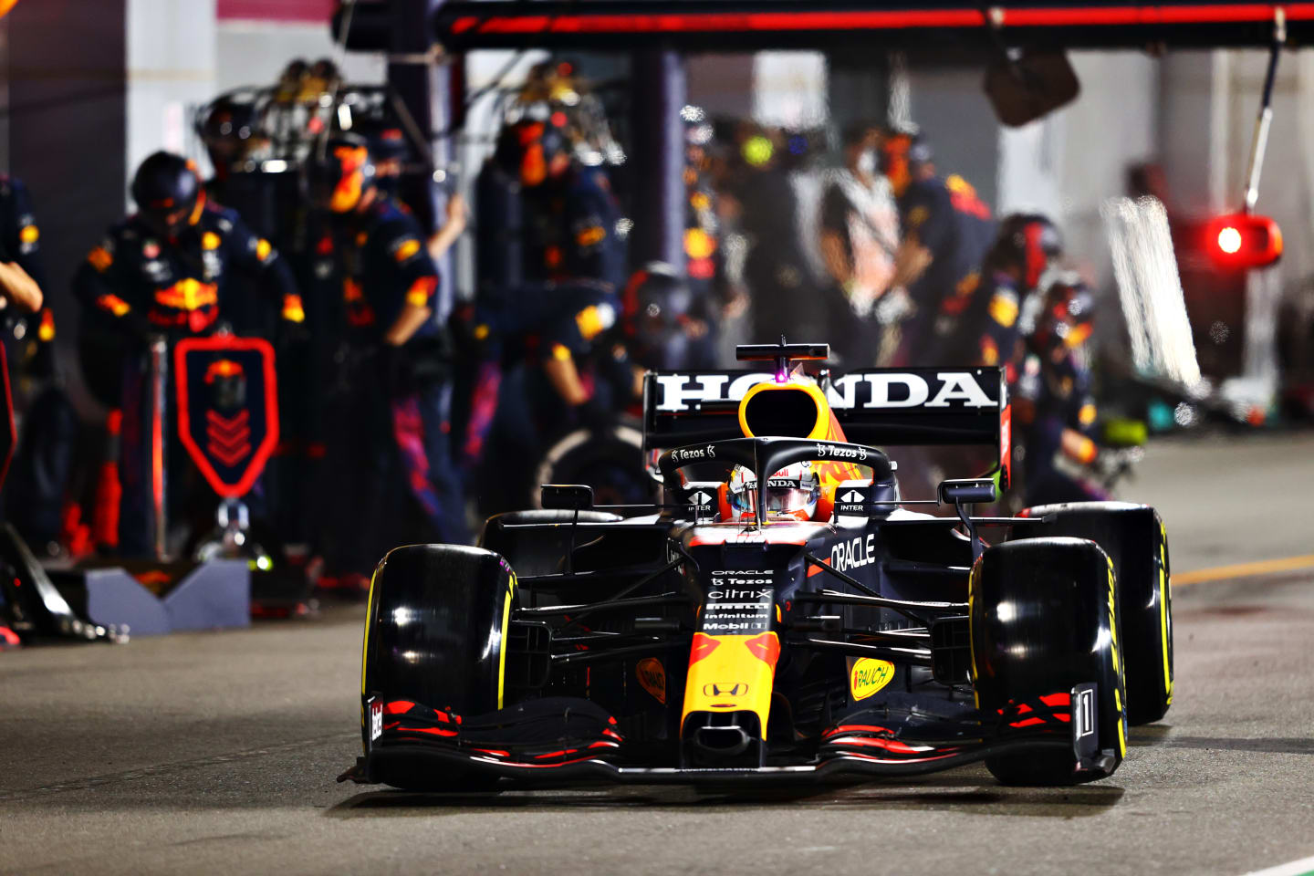 DOHA, QATAR - NOVEMBER 21: Max Verstappen of Netherlands and Red Bull Racing makes a pitstop during