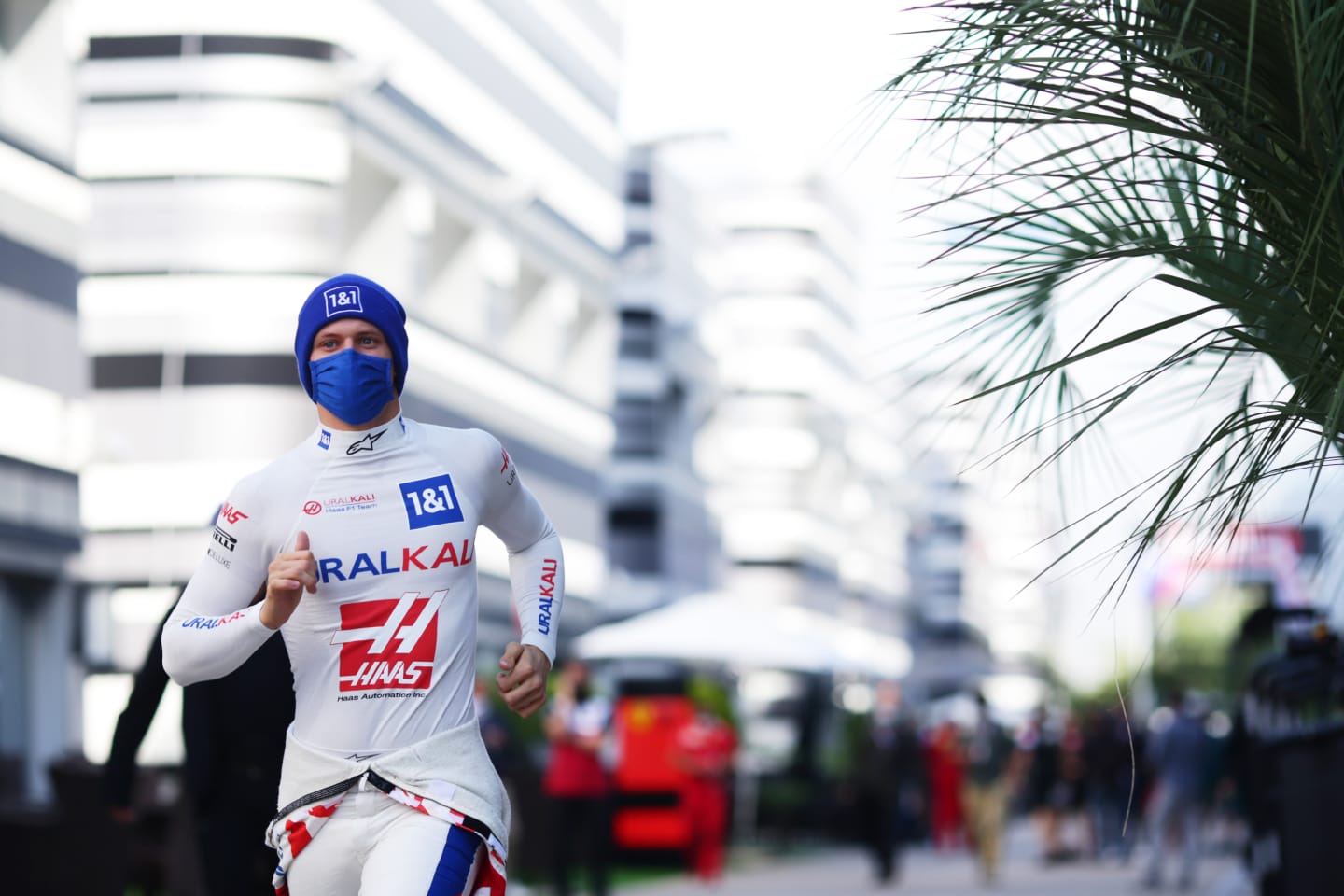 SOCHI, RUSSIA - SEPTEMBER 24: Mick Schumacher of Germany and Haas F1 runs in the Paddock before practice ahead of the F1 Grand Prix of Russia at Sochi Autodrom on September 24, 2021 in Sochi, Russia. (Photo by Peter Fox/Getty Images)