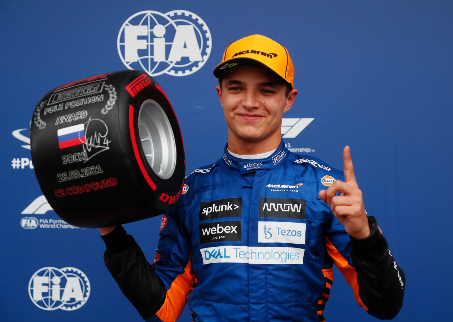 SOCHI, RUSSIA - SEPTEMBER 25: Pole position qualifier Lando Norris of Great Britain and McLaren F1 celebrates in parc ferme during qualifying ahead of the F1 Grand Prix of Russia at Sochi Autodrom on September 25, 2021 in Sochi, Russia. (Photo by Yuri Kochetkov - Pool/Getty Images)