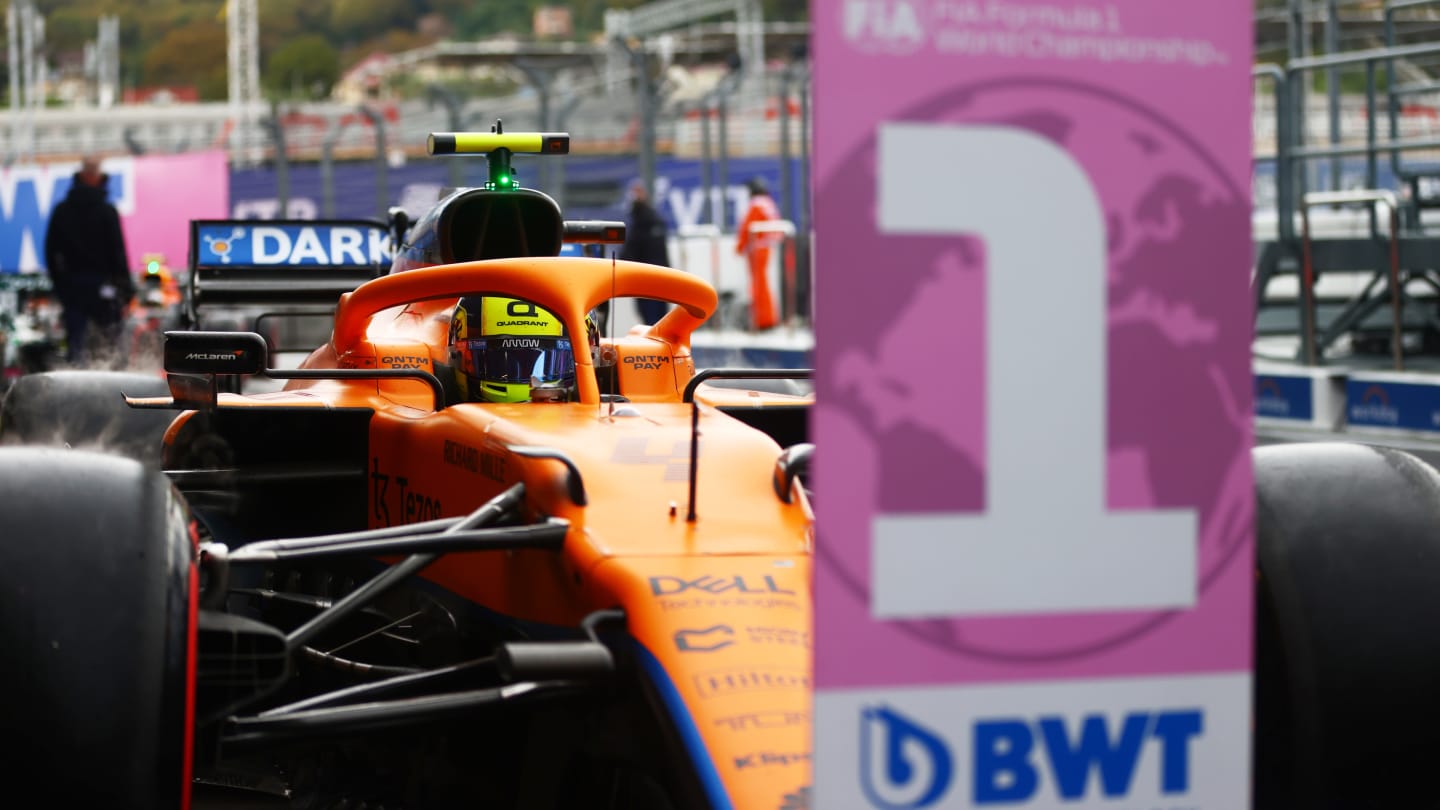 SOCHI, RUSSIA - SEPTEMBER 25: Pole position qualifier Lando Norris of Great Britain and McLaren F1 stops in parc ferme during qualifying ahead of the F1 Grand Prix of Russia at Sochi Autodrom on September 25, 2021 in Sochi, Russia. (Photo by Dan Istitene - Formula 1/Formula 1 via Getty Images)