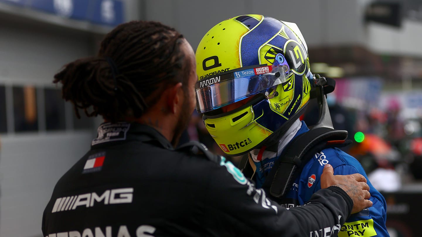 SOCHI, RUSSIA - SEPTEMBER 26: Race winner Lewis Hamilton of Great Britain and Mercedes GP hugs Lando Norris of Great Britain and McLaren F1 in parc ferme during the F1 Grand Prix of Russia at Sochi Autodrom on September 26, 2021 in Sochi, Russia. (Photo by Dan Istitene - Formula 1/Formula 1 via Getty Images)
