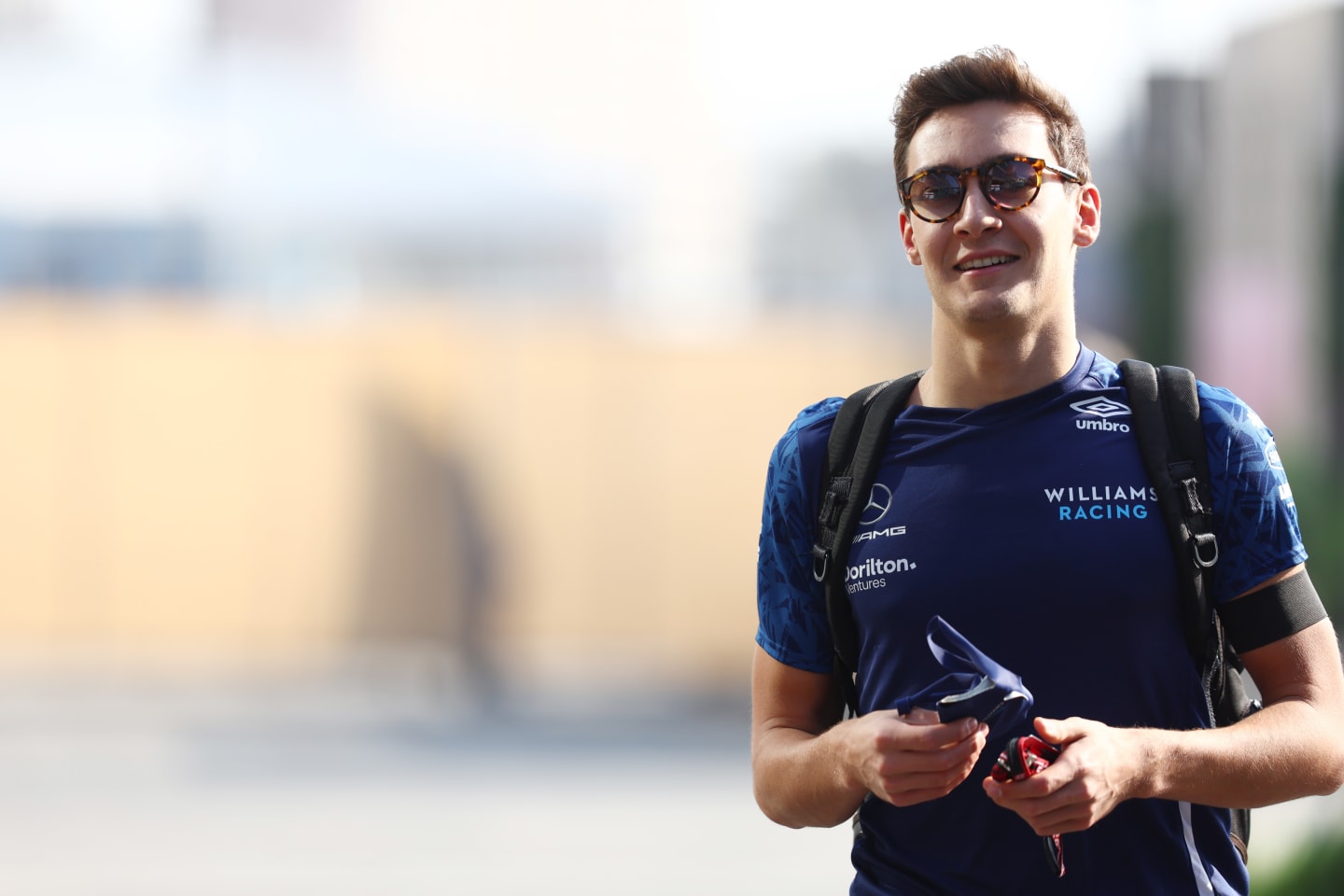 JEDDAH, SAUDI ARABIA - DECEMBER 03: George Russell of Great Britain and Williams walks in the Paddock before practice ahead of the F1 Grand Prix of Saudi Arabia at Jeddah Corniche Circuit on December 03, 2021 in Jeddah, Saudi Arabia. (Photo by Mark Thompson/Getty Images)