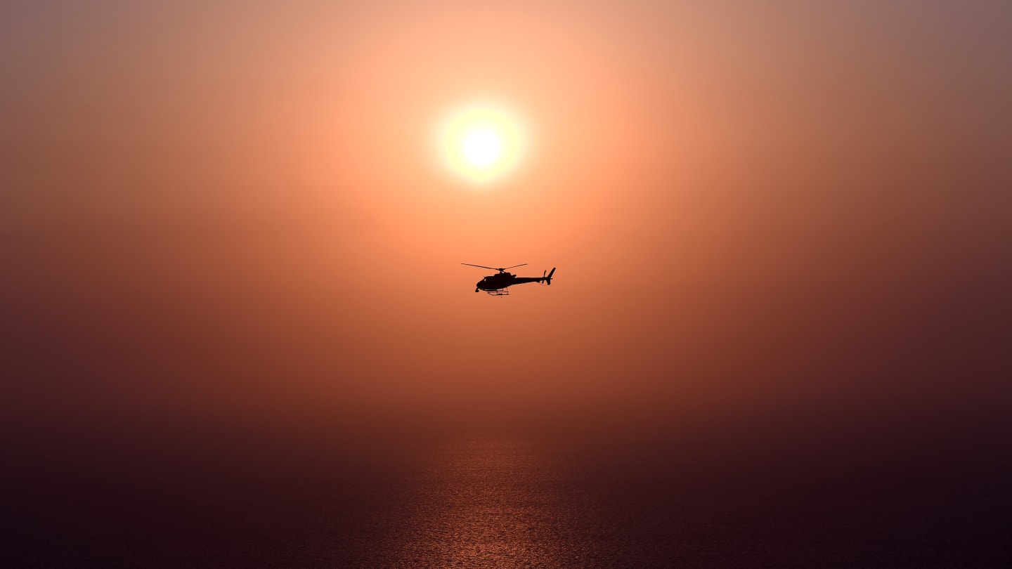 JEDDAH, SAUDI ARABIA - DECEMBER 03: A helicopter flies next to the circuit during practice ahead of