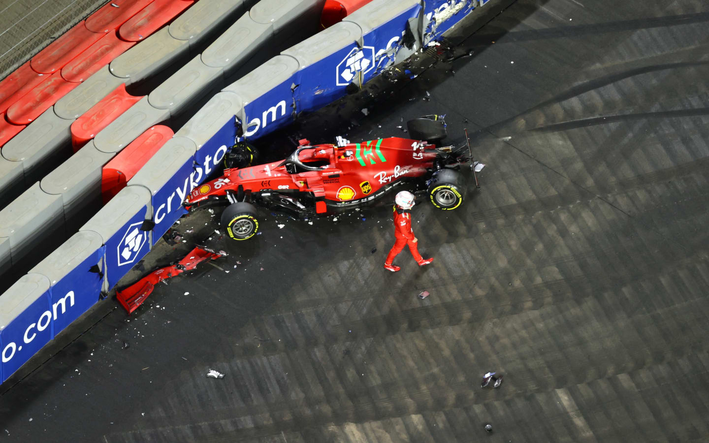 JEDDAH, SAUDI ARABIA - DECEMBER 03: Charles Leclerc of Monaco and Ferrari looks at his car after crashing during practice ahead of the F1 Grand Prix of Saudi Arabia at Jeddah Corniche Circuit on December 03, 2021 in Jeddah, Saudi Arabia. (Photo by Bryn Lennon - Formula 1/Formula 1 via Getty Images)