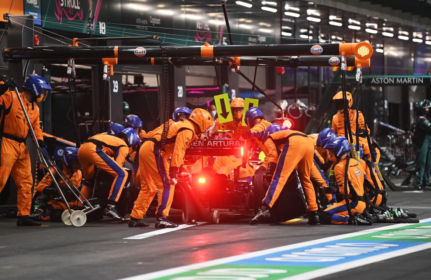 JEDDAH, SAUDI ARABIA - DECEMBER 05: Lando Norris of Great Britain driving the (4) McLaren F1 Team MCL35M Mercedes makes a pitstop during the F1 Grand Prix of Saudi Arabia at Jeddah Corniche Circuit on December 05, 2021 in Jeddah, Saudi Arabia. (Photo by Andrej Isakovic - Pool/Getty Images)