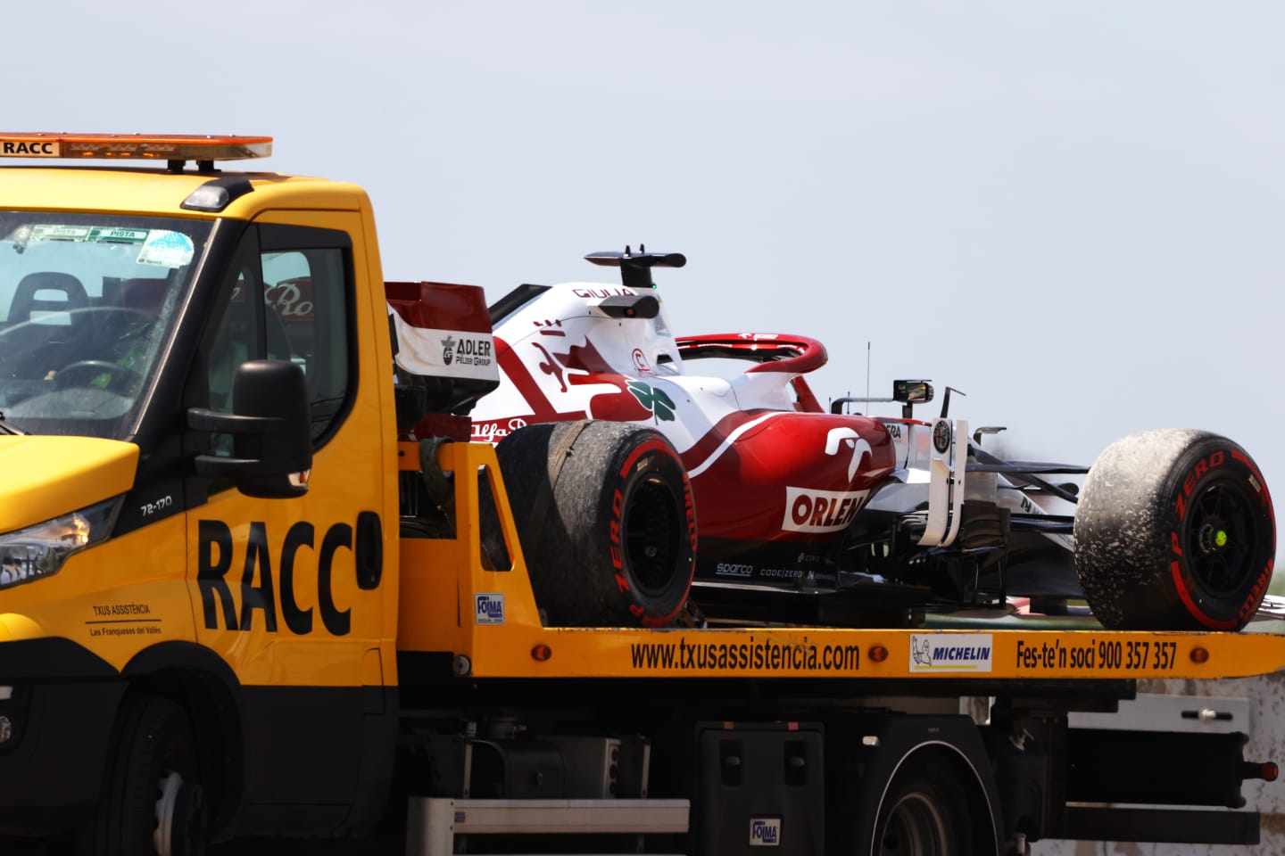 BARCELONA, SPAIN - MAY 07: The car of Robert Kubica of Poland and Alfa Romeo Racing is seen on a tow truck after stopping on track during practice for the F1 Grand Prix of Spain at Circuit de Barcelona-Catalunya on May 07, 2021 in Barcelona, Spain. (Photo by Bryn Lennon/Getty Images)