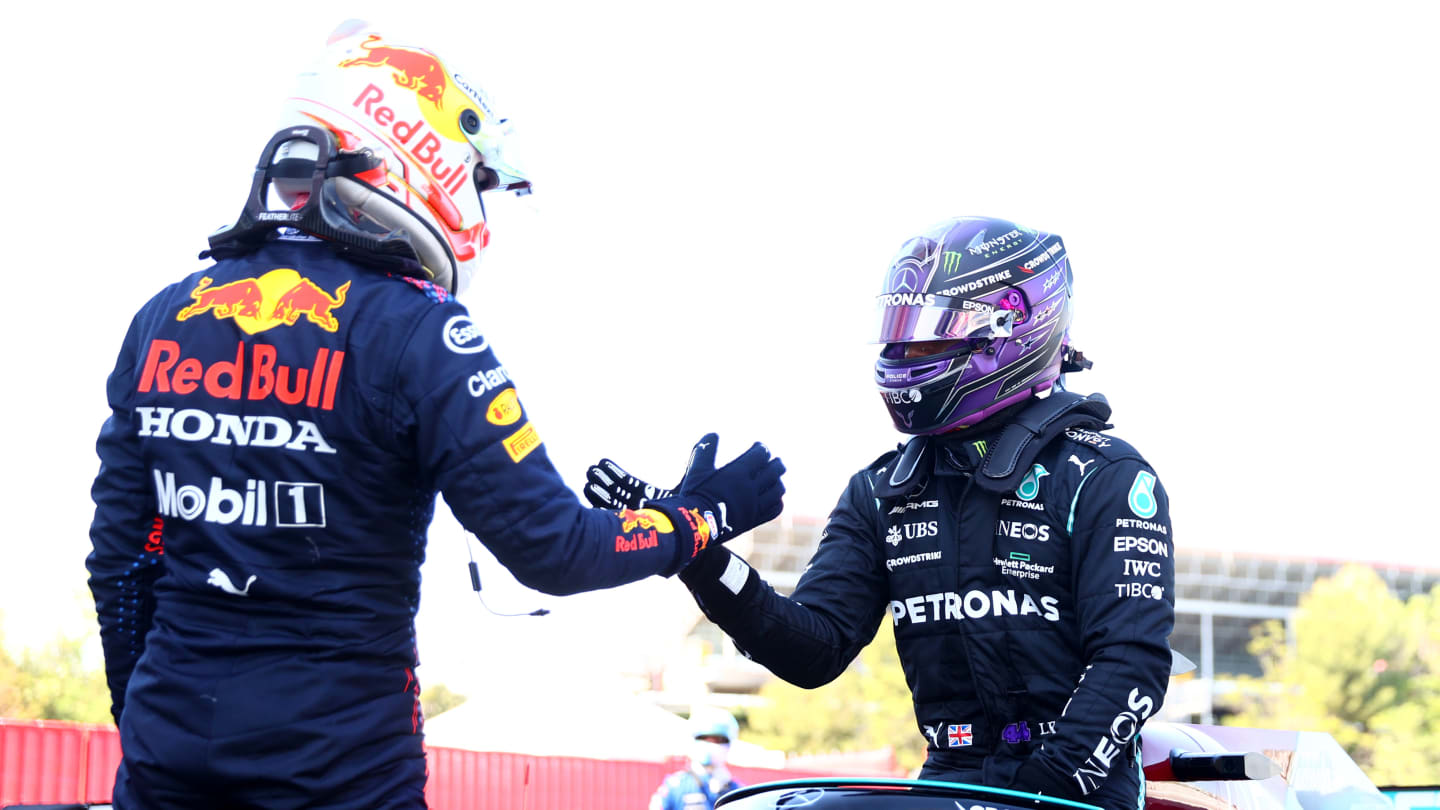 BARCELONA, SPAIN - MAY 08: Pole position qualifier Lewis Hamilton of Great Britain and Mercedes GP shakes hands with second place qualifier Max Verstappen of Netherlands and Red Bull Racing in parc ferme during qualifying for the F1 Grand Prix of Spain at Circuit de Barcelona-Catalunya on May 08, 2021 in Barcelona, Spain. (Photo by Dan Istitene - Formula 1/Formula 1 via Getty Images)