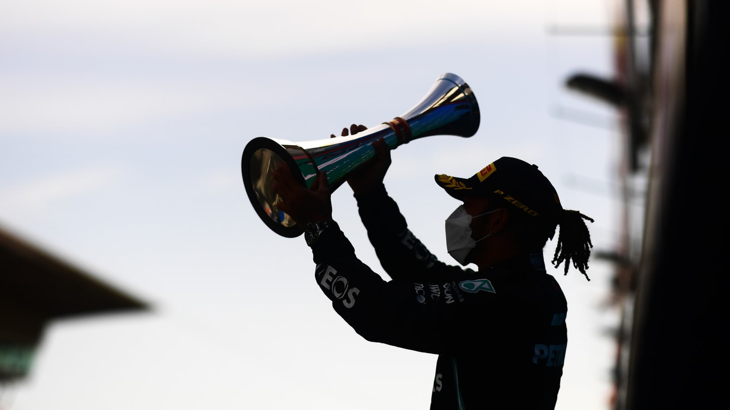 BARCELONA, SPAIN - MAY 09: Race winner Lewis Hamilton of Great Britain and Mercedes GP celebrates with his trophy on the podium during the F1 Grand Prix of Spain at Circuit de Barcelona-Catalunya on May 09, 2021 in Barcelona, Spain. (Photo by Mario Renzi - Formula 1/Formula 1 via Getty Images)