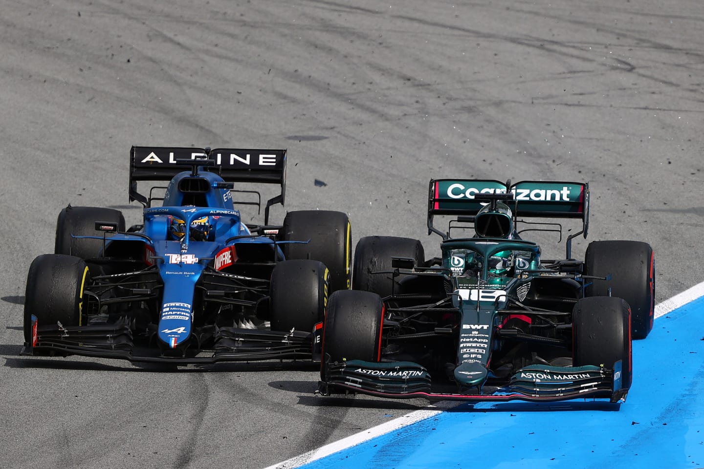 BARCELONA, SPAIN - MAY 09: Lance Stroll of Canada driving the (18) Aston Martin AMR21 Mercedes and Fernando Alonso of Spain driving the (14) Alpine A521 Renault battle for position during the F1 Grand Prix of Spain at Circuit de Barcelona-Catalunya on May 09, 2021 in Barcelona, Spain. (Photo by Bryn Lennon/Getty Images)