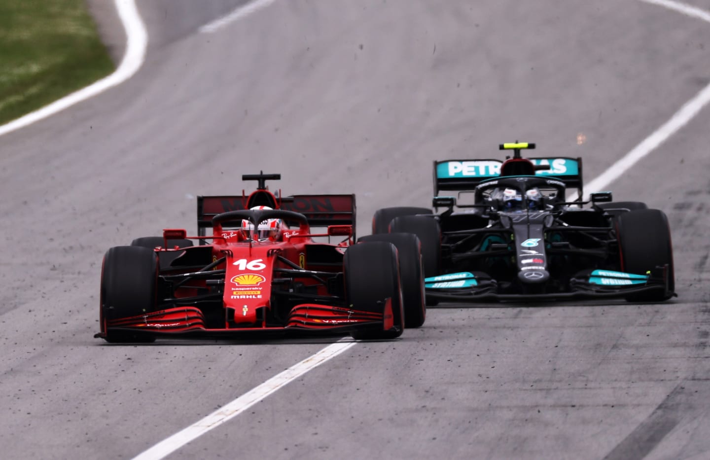 BARCELONA, SPAIN - MAY 09: Charles Leclerc of Monaco driving the (16) Scuderia Ferrari SF21 leads Valtteri Bottas of Finland driving the (77) Mercedes AMG Petronas F1 Team Mercedes W12 on track during the F1 Grand Prix of Spain at Circuit de Barcelona-Catalunya on May 09, 2021 in Barcelona, Spain. (Photo by Lars Baron/Getty Images)