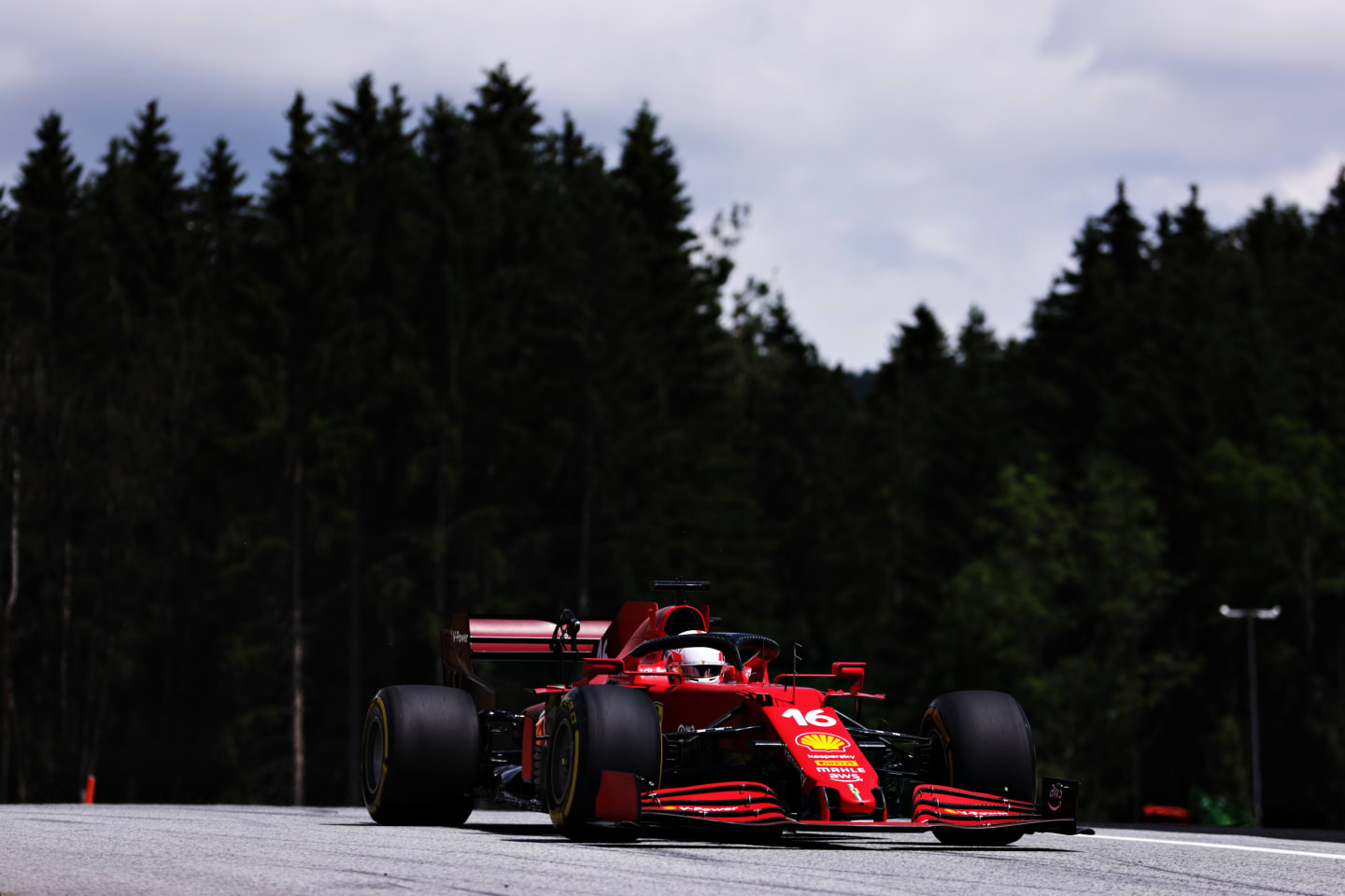 SPIELBERG, AUSTRIA - JUNE 25: Charles Leclerc of Monaco driving the (16) Scuderia Ferrari SF21 on