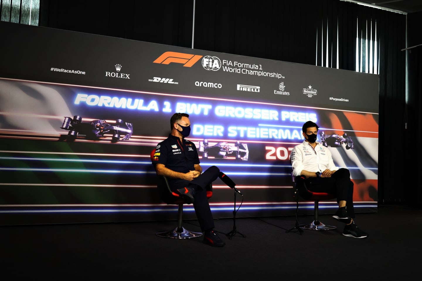 SPIELBERG, AUSTRIA - JUNE 25: Red Bull Racing Team Principal Christian Horner and Mercedes GP Executive Director Toto Wolff talk in a press conference  during practice ahead of the F1 Grand Prix of Styria at Red Bull Ring on June 25, 2021 in Spielberg, Austria. (Photo by Bryn Lennon/Getty Images)
