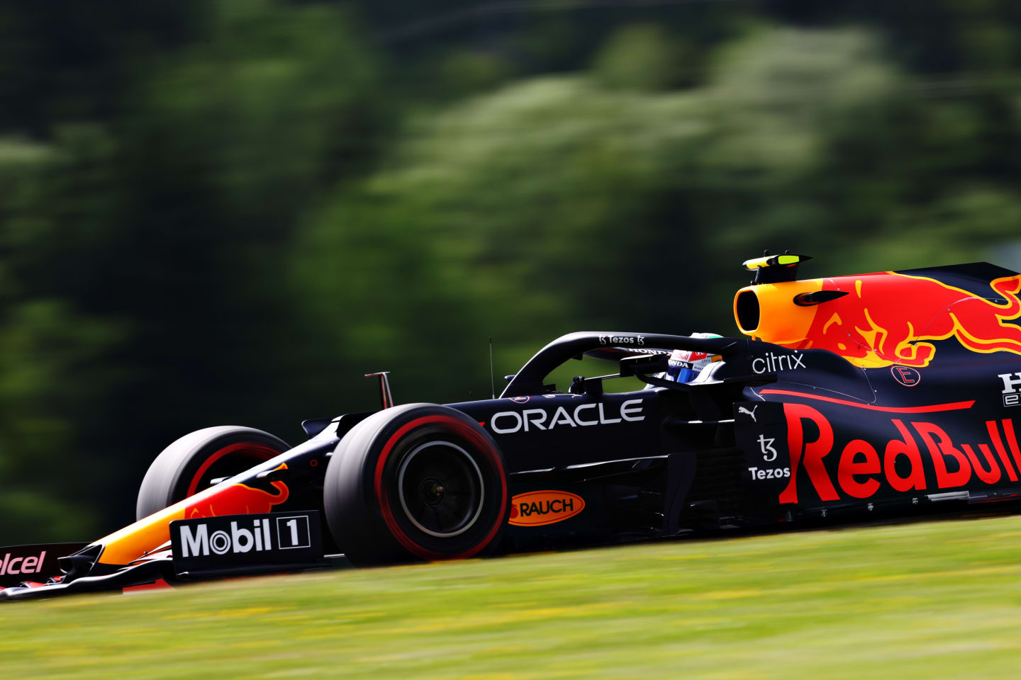 SPIELBERG, AUSTRIA - JUNE 25: Sergio Perez of Mexico driving the (11) Red Bull Racing RB16B Honda on track during practice ahead of the F1 Grand Prix of Styria at Red Bull Ring on June 25, 2021 in Spielberg, Austria. (Photo by Clive Rose/Getty Images)