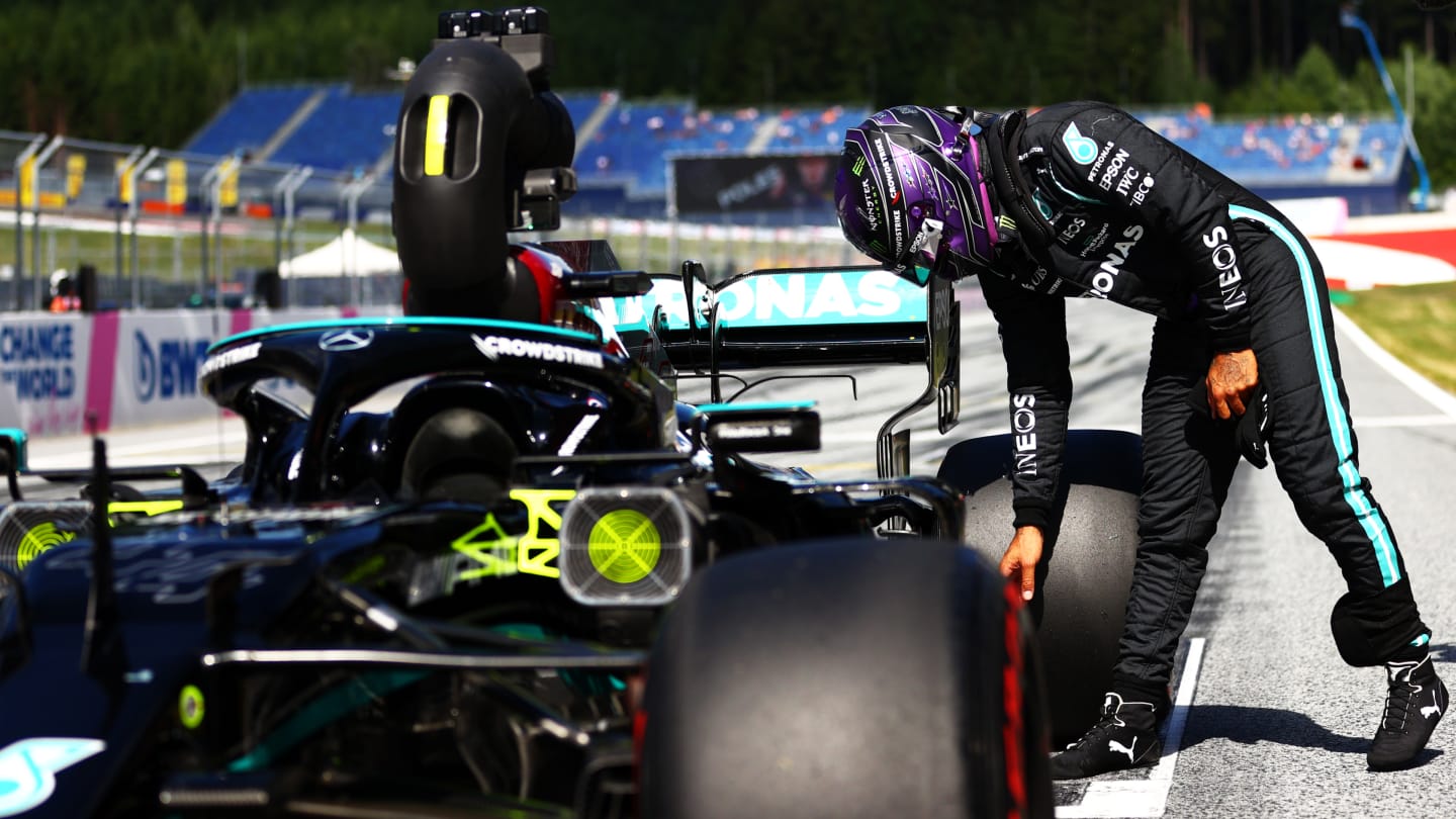 SPIELBERG, AUSTRIA - JUNE 26: Third place qualifier Lewis Hamilton of Great Britain and Mercedes GP inspects his car in parc ferme during qualifying ahead of the F1 Grand Prix of Styria at Red Bull Ring on June 26, 2021 in Spielberg, Austria. (Photo by Dan Istitene - Formula 1/Formula 1 via Getty Images)