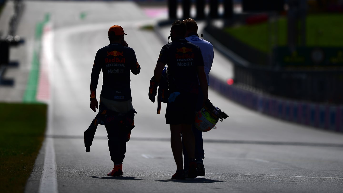SPIELBERG, AUSTRIA - JUNE 26: Pole position qualifier Max Verstappen of Netherlands and Red Bull Racing walks from parc ferme during qualifying ahead of the F1 Grand Prix of Styria at Red Bull Ring on June 26, 2021 in Spielberg, Austria. (Photo by Mario Renzi - Formula 1/Formula 1 via Getty Images)