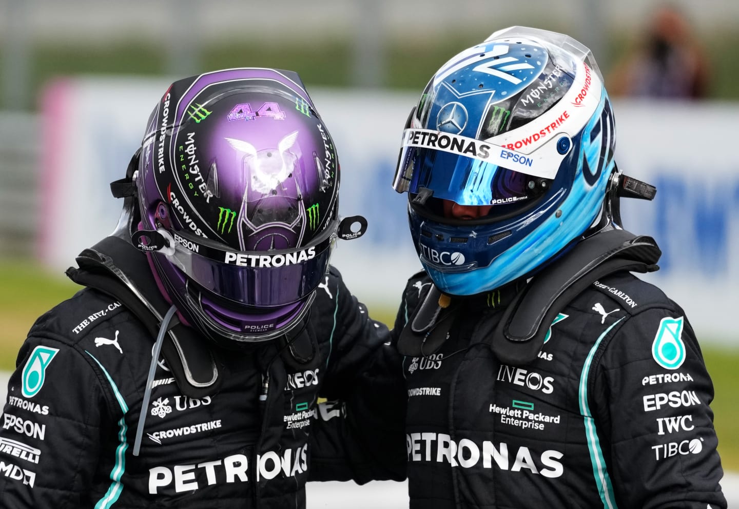 SPIELBERG, AUSTRIA - JUNE 27: Second placed Lewis Hamilton of Great Britain and Mercedes GP and third placed Valtteri Bottas of Finland and Mercedes GP hug in parc ferme during the F1 Grand Prix of Styria at Red Bull Ring on June 27, 2021 in Spielberg, Austria. (Photo by Darko Vojinovic - Pool/Getty Images)
