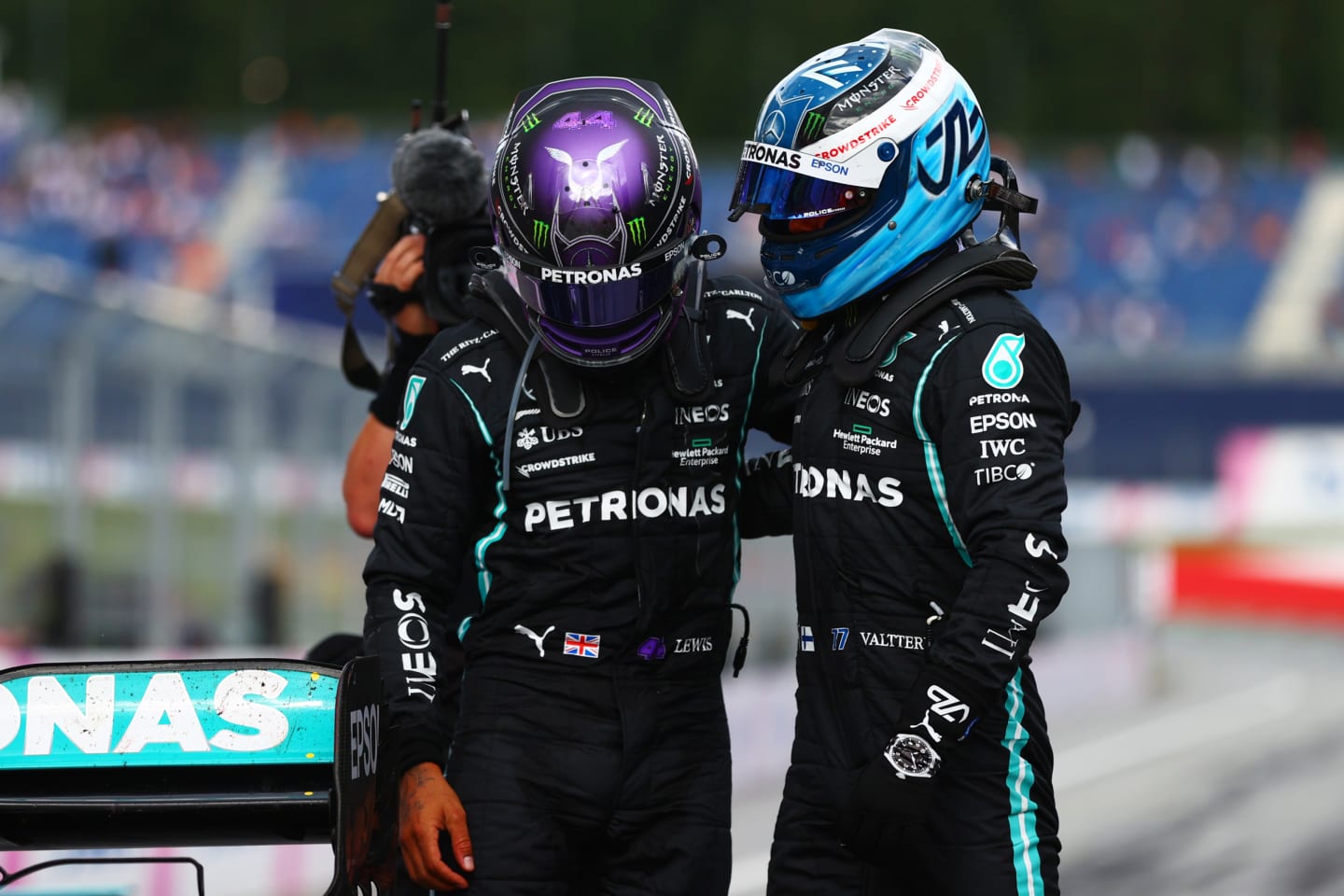 SPIELBERG, AUSTRIA - JUNE 27: Second placed Lewis Hamilton of Great Britain and Mercedes GP and third placed Valtteri Bottas of Finland and Mercedes GP hug in parc ferme during the F1 Grand Prix of Styria at Red Bull Ring on June 27, 2021 in Spielberg, Austria. (Photo by Dan Istitene - Formula 1/Formula 1 via Getty Images)
