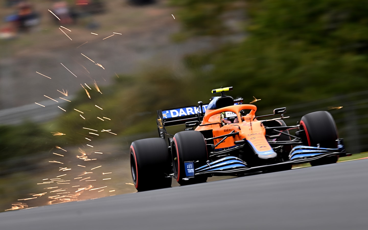 ISTANBUL, TURKEY - OCTOBER 09: Sparks fly behind Lando Norris of Great Britain driving the (4) McLaren F1 Team MCL35M Mercedes during qualifying ahead of the F1 Grand Prix of Turkey at Intercity Istanbul Park on October 09, 2021 in Istanbul, Turkey. (Photo by Clive Mason - Formula 1/Formula 1 via Getty Images)