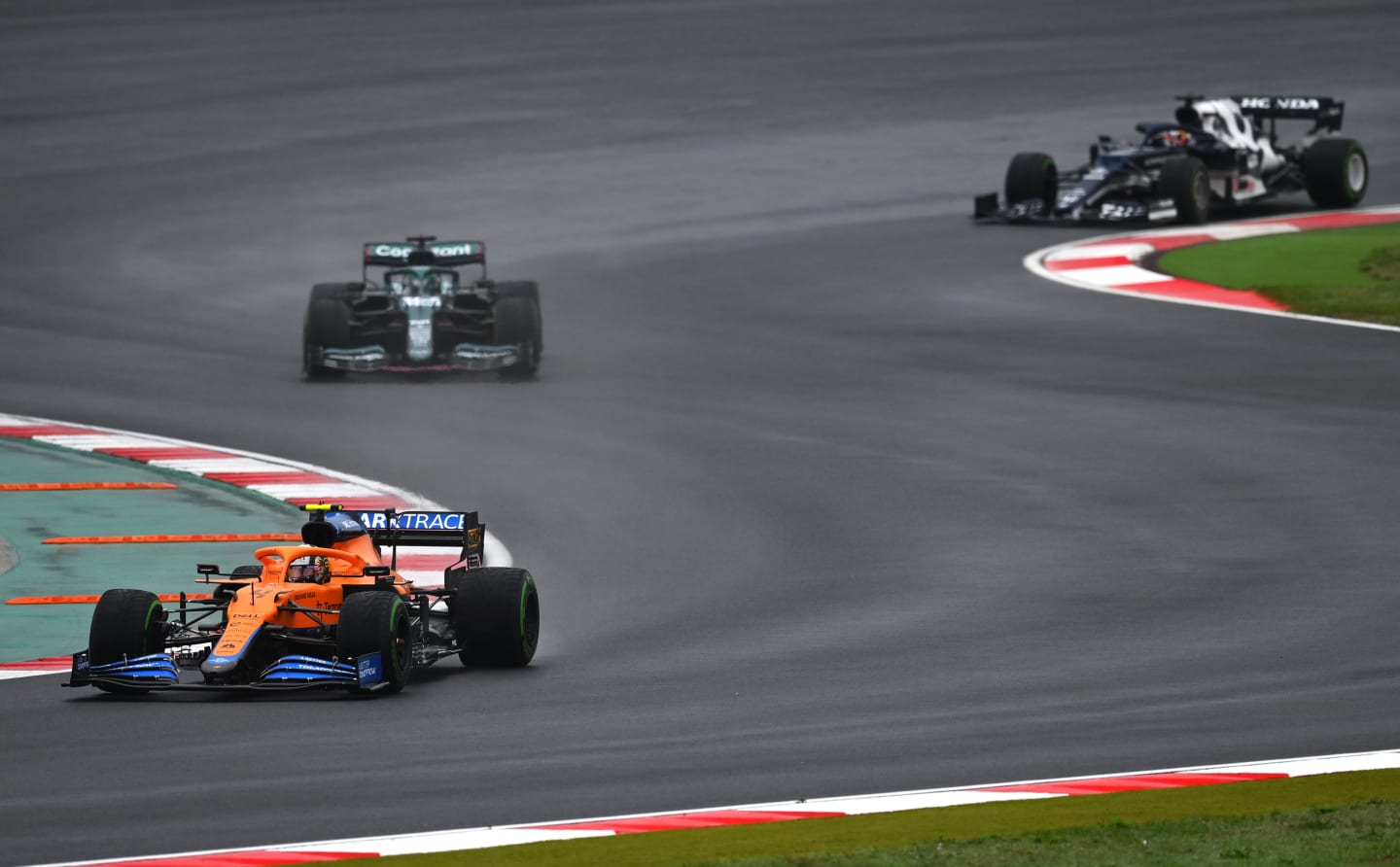 ISTANBUL, TURKEY - OCTOBER 10: Lando Norris of Great Britain driving the (4) McLaren F1 Team MCL35M Mercedes leads Lance Stroll of Canada driving the (18) Aston Martin AMR21 Mercedes during the F1 Grand Prix of Turkey at Intercity Istanbul Park on October 10, 2021 in Istanbul, Turkey. (Photo by Dan Mullan/Getty Images)
