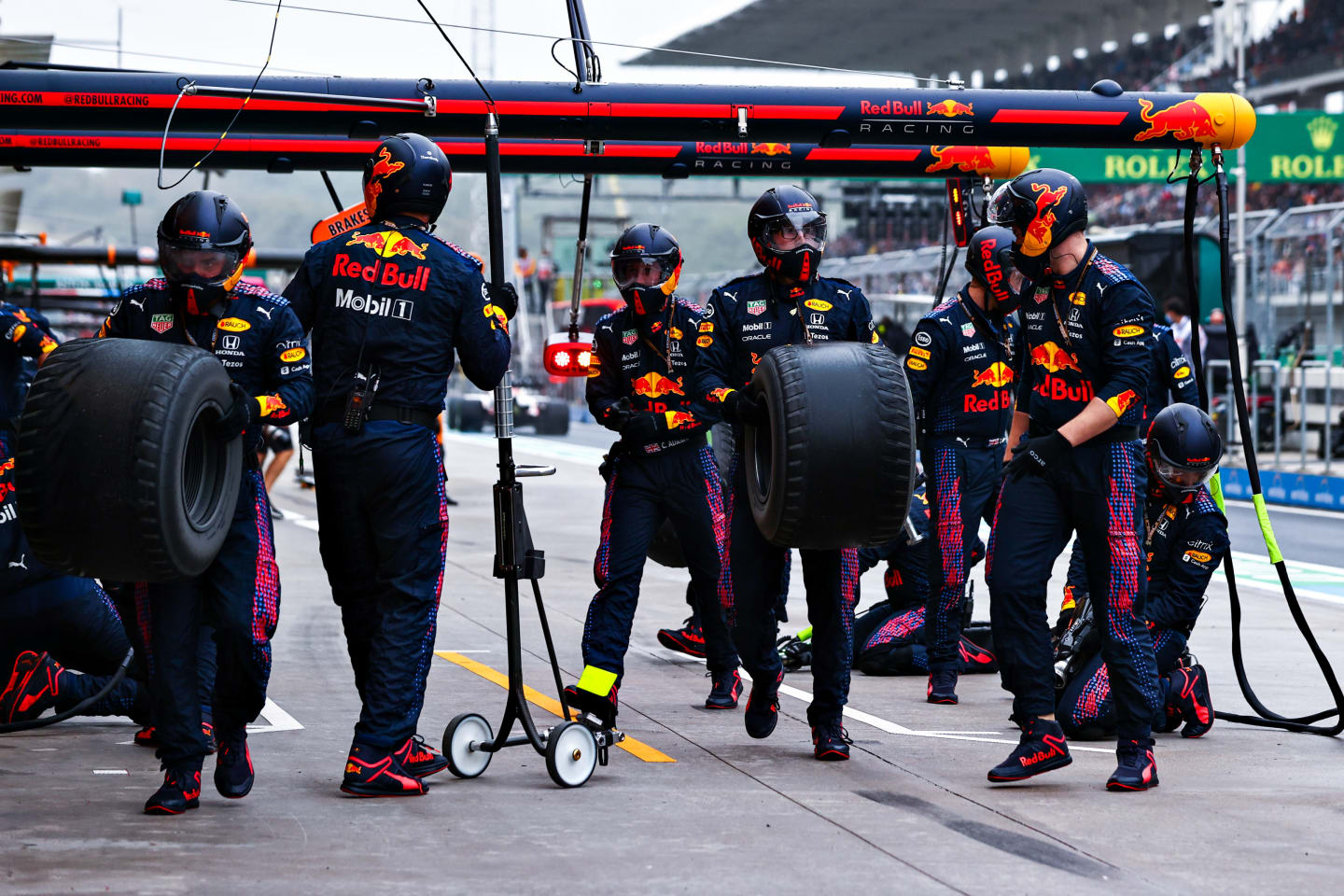 ISTANBUL, TURKEY - OCTOBER 10: The Red Bull Racing team carry in used tyres after a pitstop during